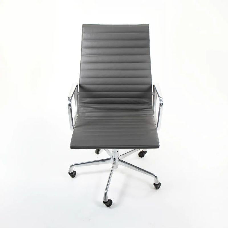 This is an original Eames Aluminum Group High Back Executive Desk Chair designed by Charles and Ray Eames for Herman Miller in 1958. This particular chair was produced in the 2010s. The design sports a solid yet lightweight aluminum frame and is