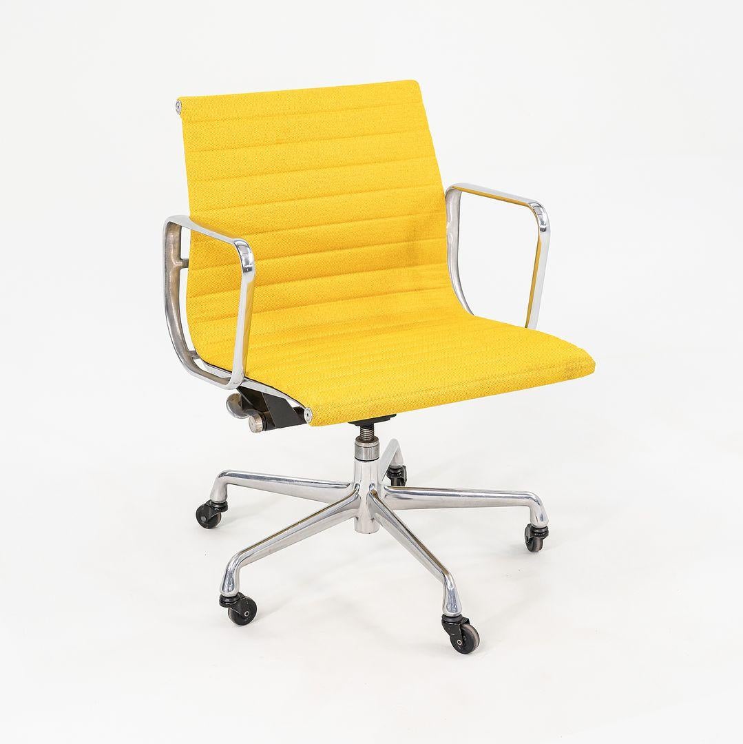 This is an Eames Aluminum Group Management Desk Chair, designed by Charles and Ray Eames for Herman Miller in 1958. This particular chair was produced in the 2010s. The design sports a solid yet lightweight aluminum frame, and its upholstery is in a