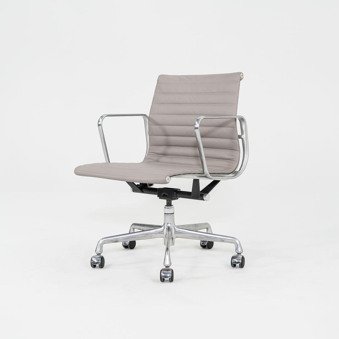 These are Eames Aluminum Group Management Chairs, originally designed by Charles and Ray Eames for Herman Miller in 1958. These particular examples were produced in the 2010s. Their design features an adjustable aluminum 5-star base with a