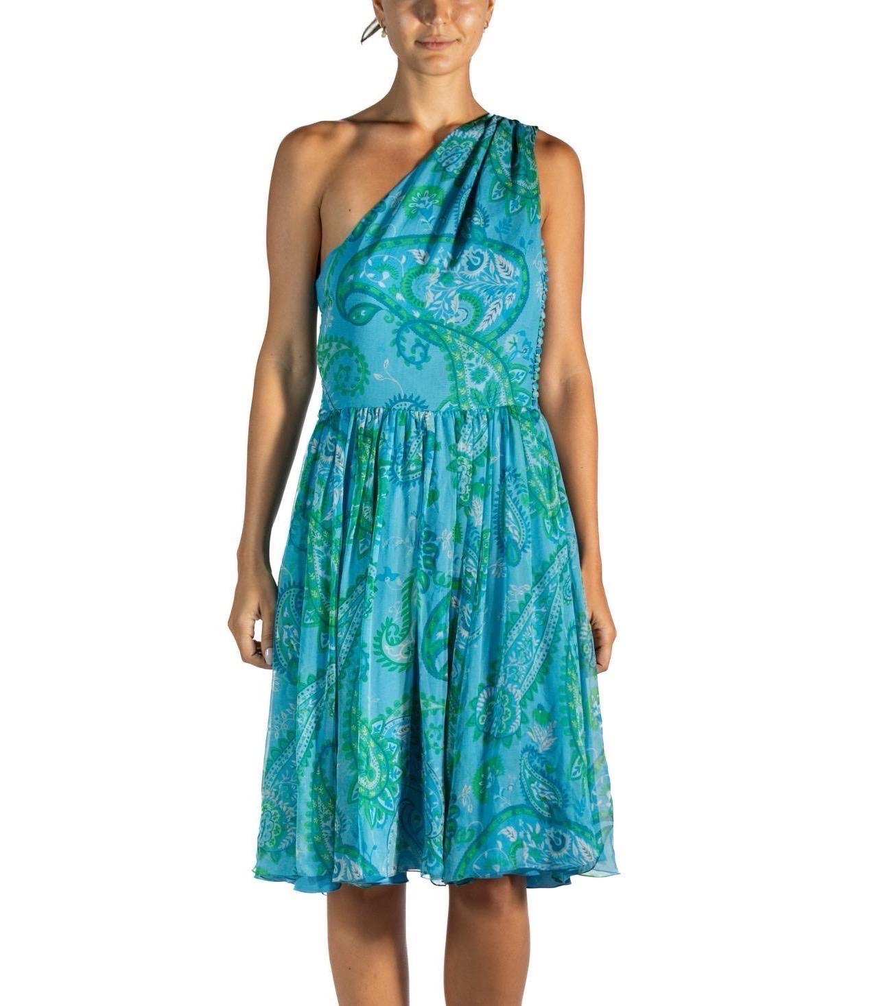 2010S John Galliano Christian Dior Blue & Green Paisley Silk Chiffon One Shoulder Dress
MORPHEW VINTAGE represents the finest pieces of fashions past. Sourced from across the globe, dating as far back as a century. Each piece is selected with both