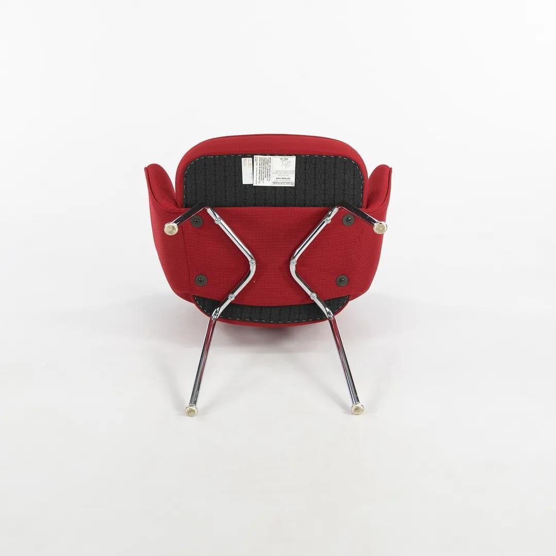 This is a Saarinen Executive Arm Chair, Model 71A, designed in 1948 by Eero Saarinen and produced by Knoll. This particular example was produced in the 2010s. The design features chromed-steel tubular legs, and has an upholstered seat and back. The