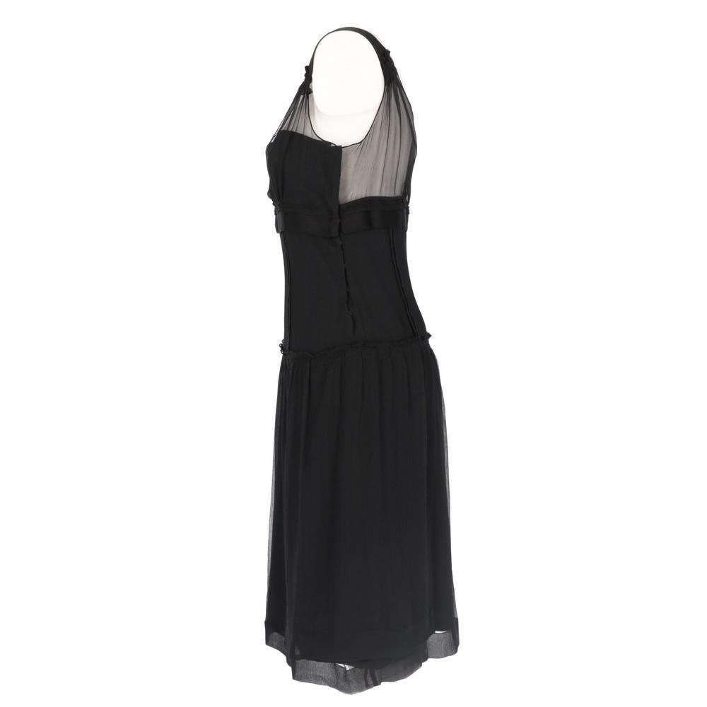 Miu Miu black silk sleeveless dress. Knee-length and removable gathered silk shoulders. Snap button side fastening.

Years: 2010s
Made in Italy

Taglia: 42 IT
Misure lineari
Altezza: 100 cm
Torace: 38 cm