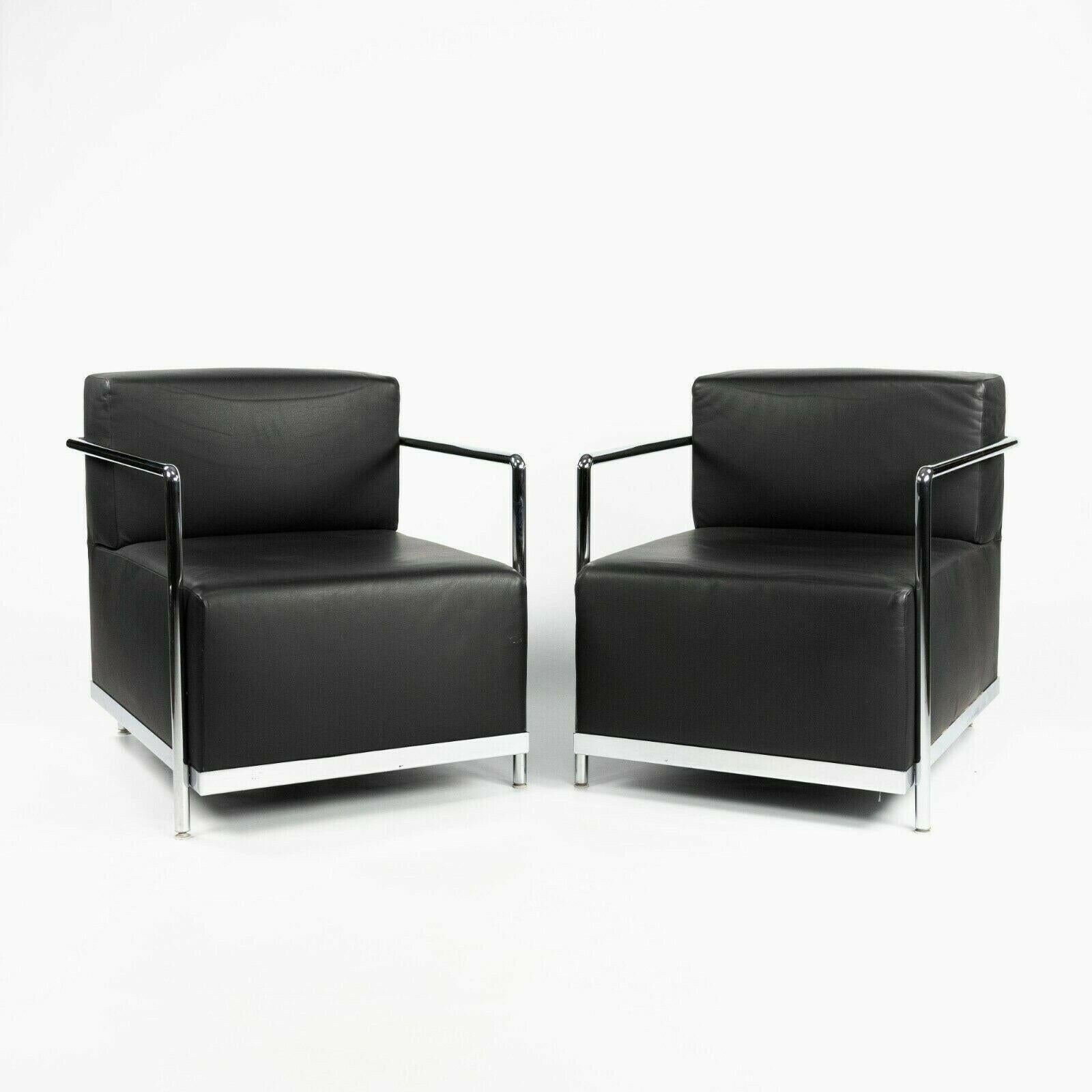 Listed for sale is a pair of Bernhardt Design club chairs in black leather with chromed tubular frames. This design is clearly reminiscent of early bauhaus designs such as Le Corbusier's LC2 petit model and works by Mies Van Der Rohe or Marcel