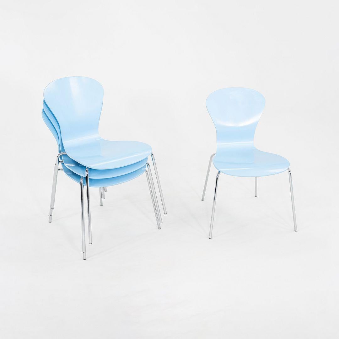 This is a Sprite Side Chair, originally designed by Ross Lovegrove for Knoll in 2004. These particular examples were produced in the United States in the 2010s. They are comprised of a blue molded plywood shell with a chrome base. 
 
 The listed