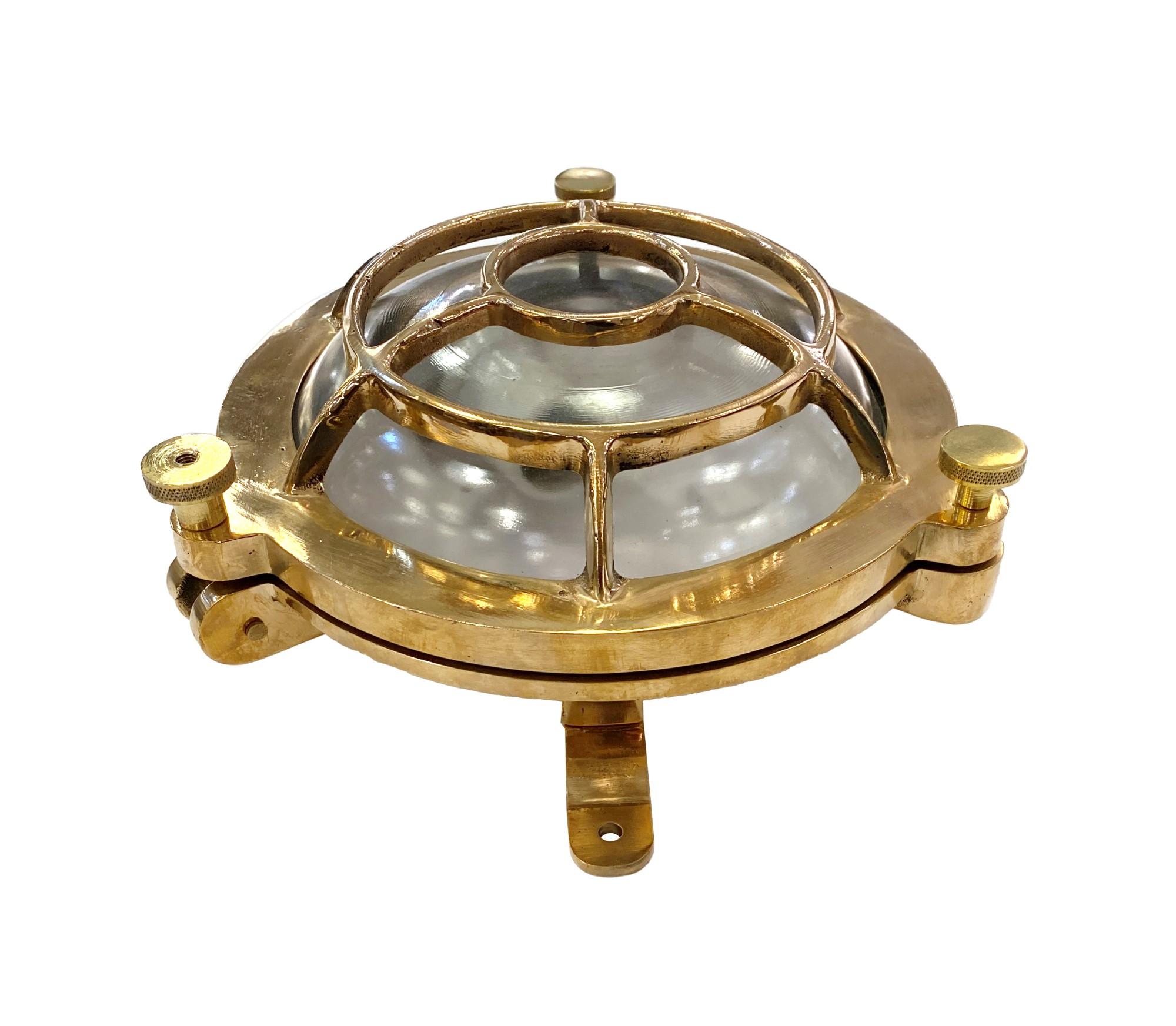 2010s cast brass round nautical bulkhead ship light. Newly wired and take one medium base 60 watt incandescent bulb. Can be used either as a ceiling light or wall sconce. With new industrial rubber gasket. Small quantity available at time of