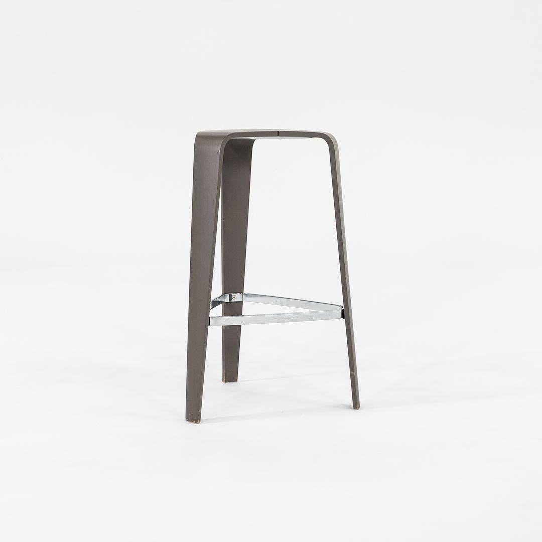 This is a set of four Tre Bar Stools. These stools were designed by Jehs + Laub. These particular examples were produced by Davis in the USA circa 2010s. They are comprised of three separate pieces of molded plywood. The listed price includes all
