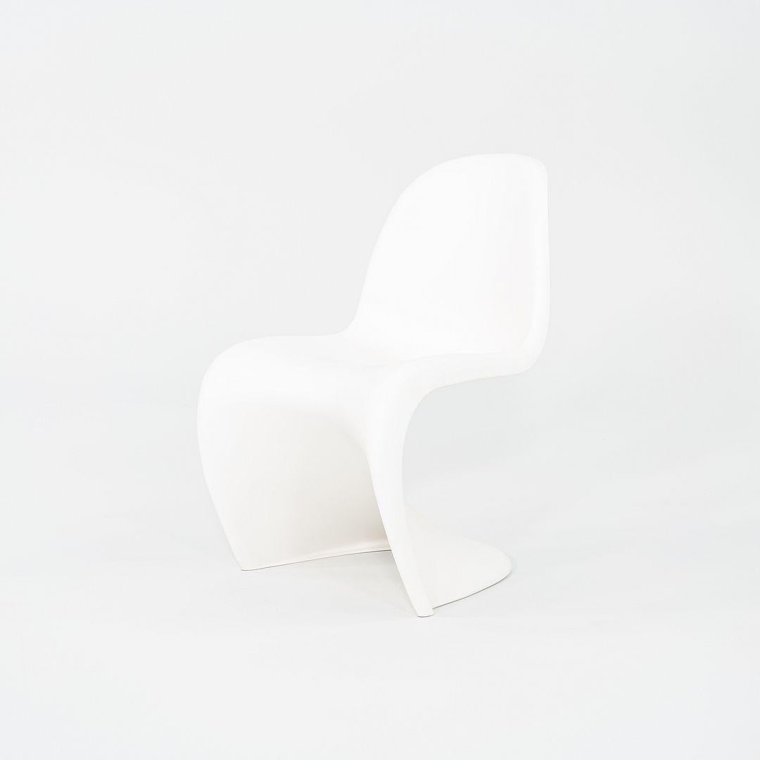 This is a set of six Panton Chairs, originally designed by Verner Panton for Vitra in 1959. These particular examples were produced in Germany in the 2010s. They are comprised entirely of polypropylene and feature a cantilever design. The listed