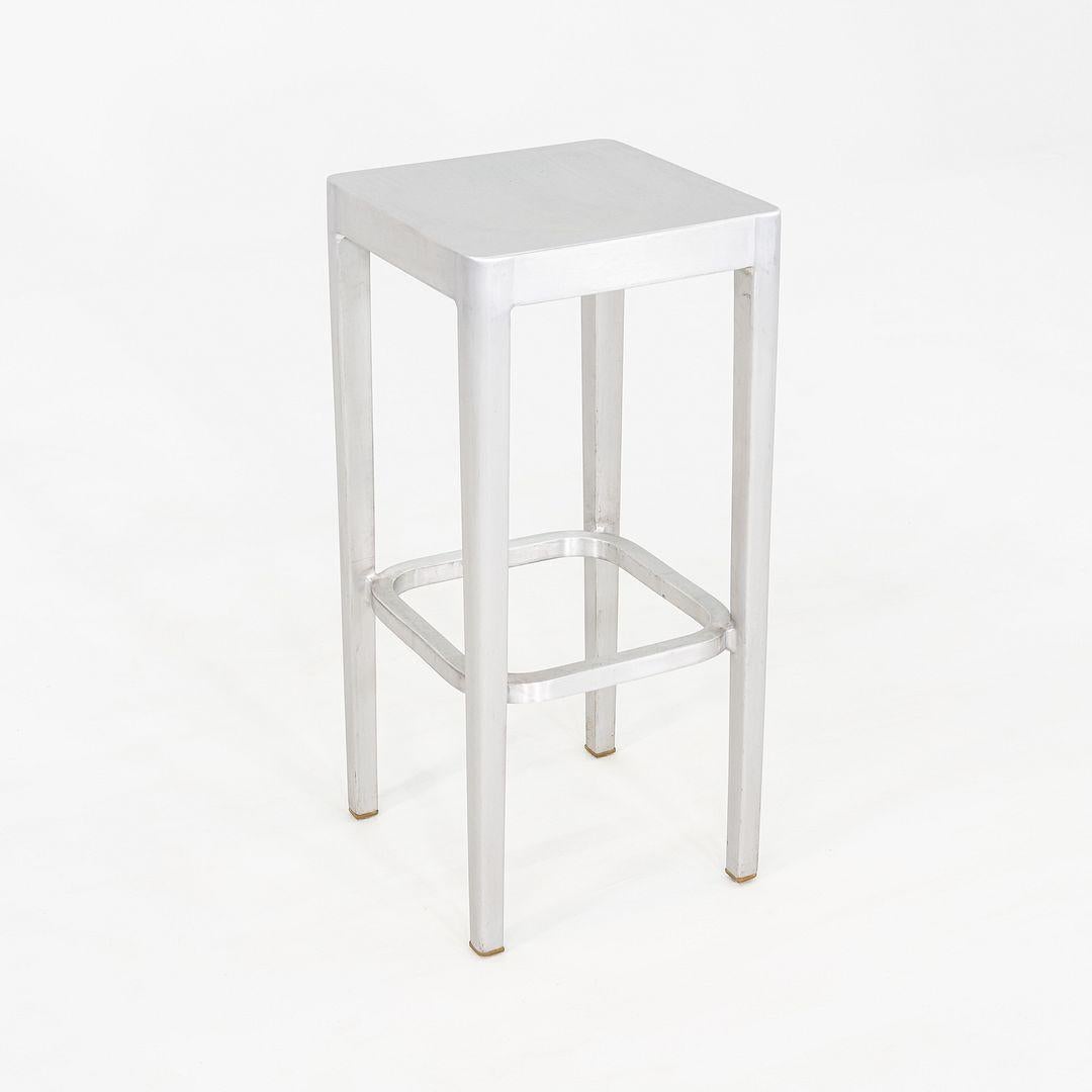 This is a set of three Emeco Bar Stools, originally designed by Philippe Starck for Emeco in 2001. These particular examples were produced in the United States in the 2010s. The stools are comprised entirely from thermal treated recycled aluminum.