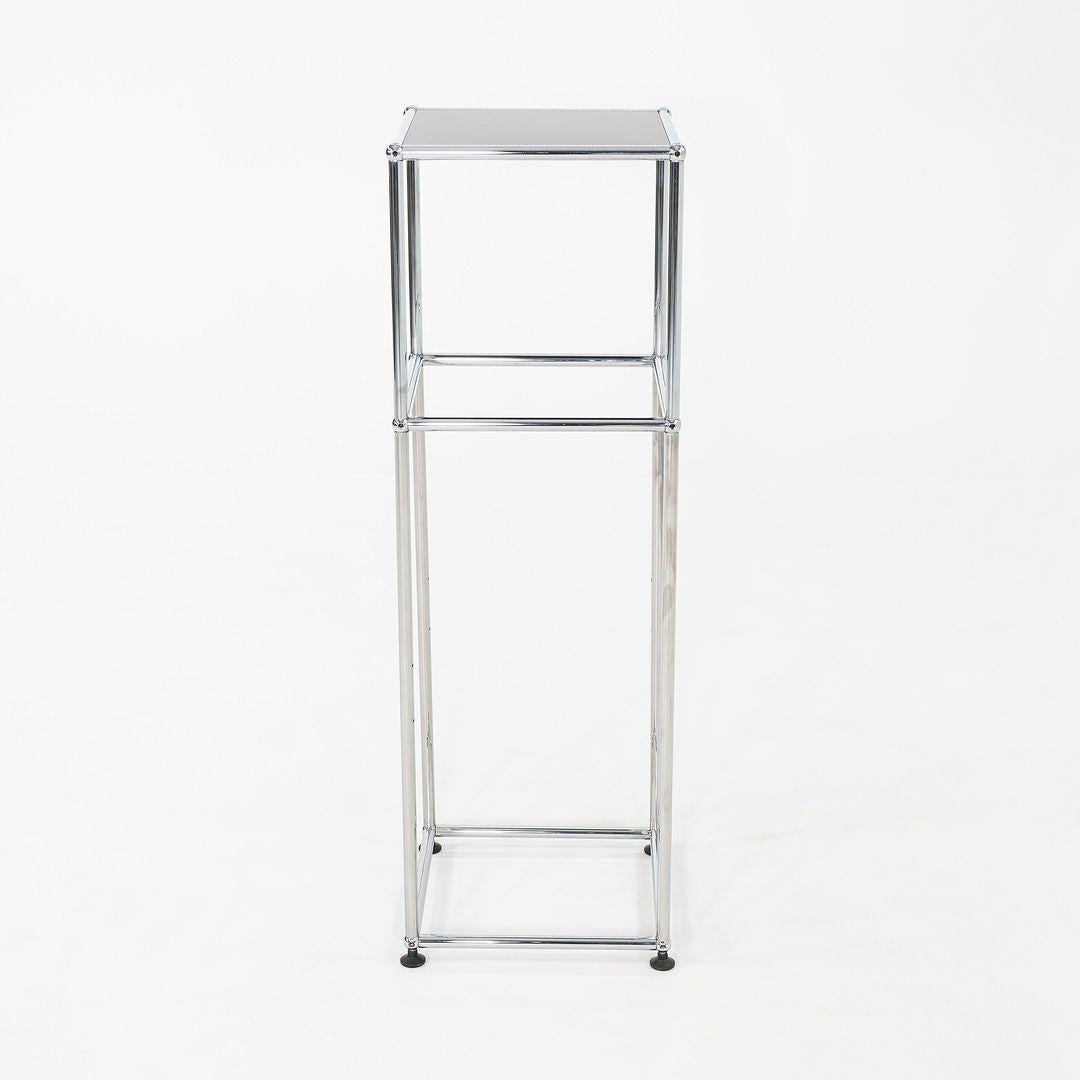These are USM Haller Pedestals that were produced by USM in the 2010s. USM's modular furniture system was originally designed by Fritz Haller and Paul Schaerer in 1963. The pedestals are comprised of black powder coated steel panels and a chromed