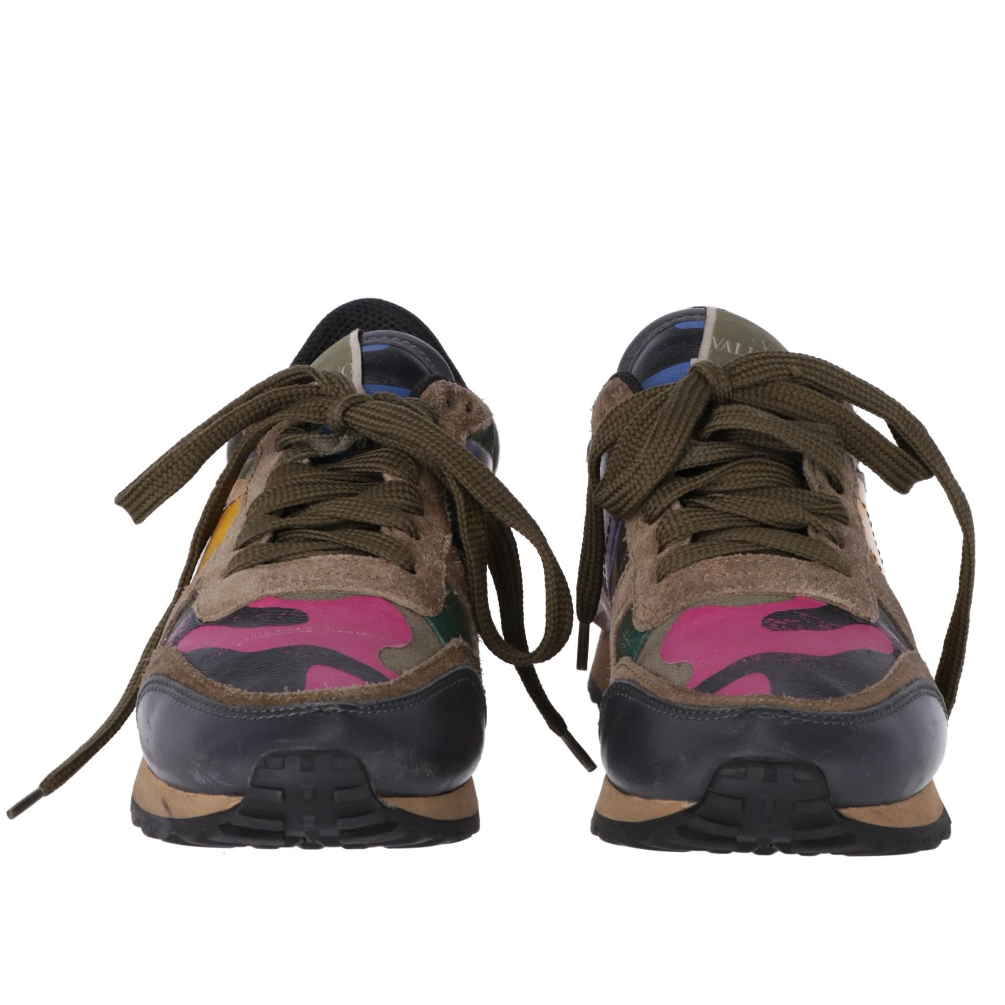 Valentino Garavani Rockrunner sneakers in leather, suede and fabric with green, fuchsia, purple and yellow camouflage pattern, rubber sole with rubber studs detail. Box, spare laces and dust bag are included.

The shoes showed slight signs of wear