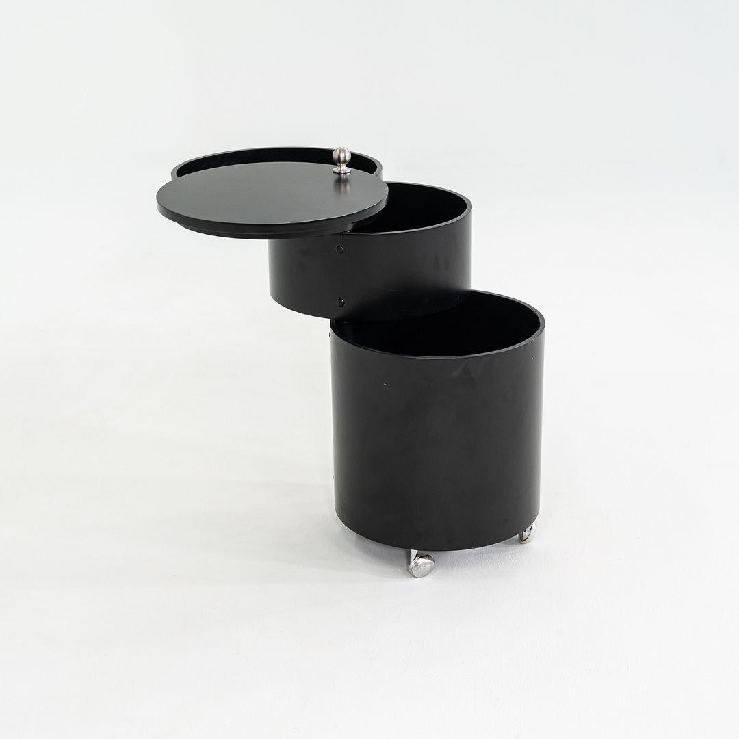 This is a Barboy, originally designed by Verpan Panton in 1963. This particular example was produced by Verpan in Denmark in the 2010s. The Barboy is comprised of molded wood and is painted black and features chrome plated castors. 

The Barboy