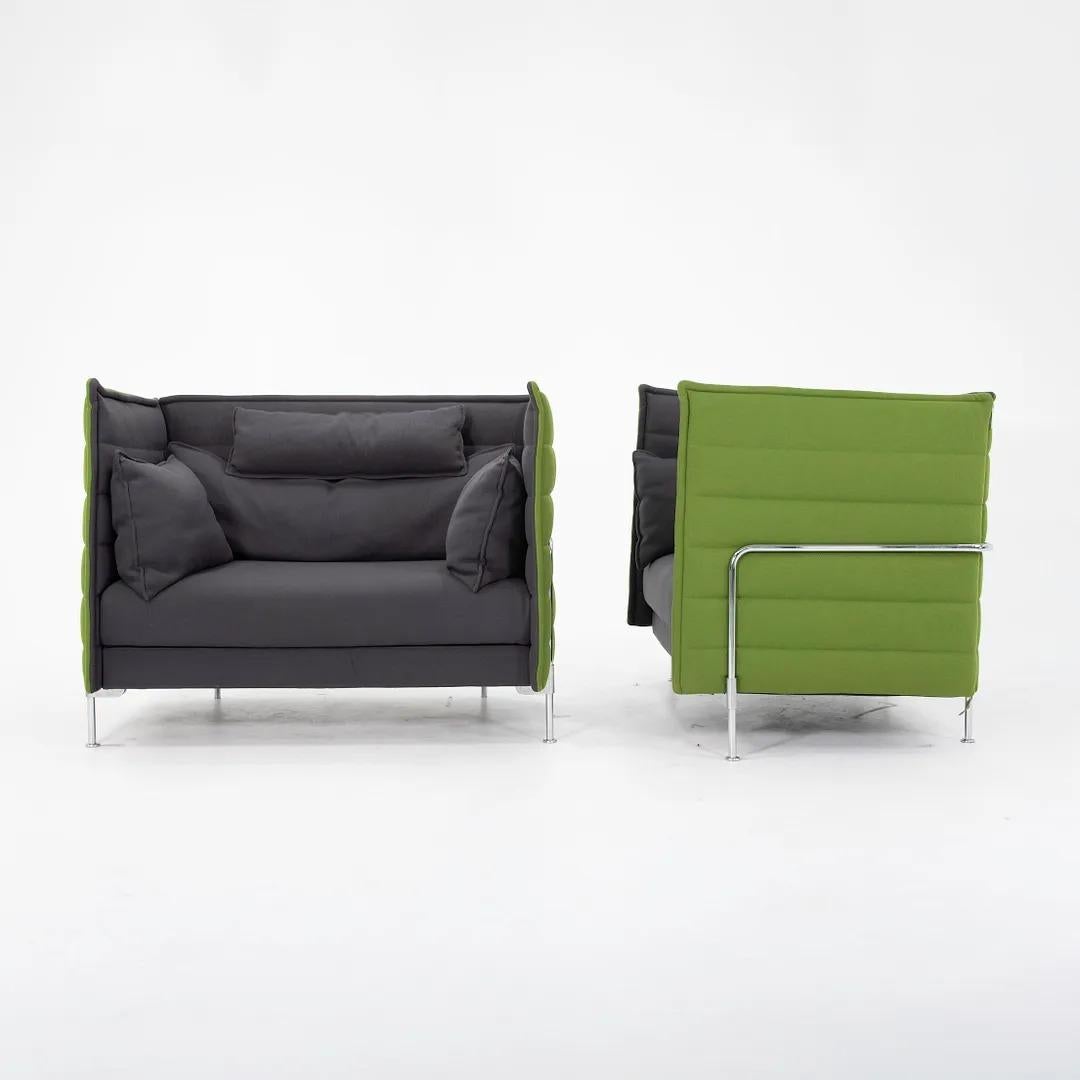 This is a pair of Vitra Alcove love seats in green and gray fabric, designed by Erwan and Ronan Bouroullec, produced by Vitra. Production of this line started on 2006 and was meant to provide a 