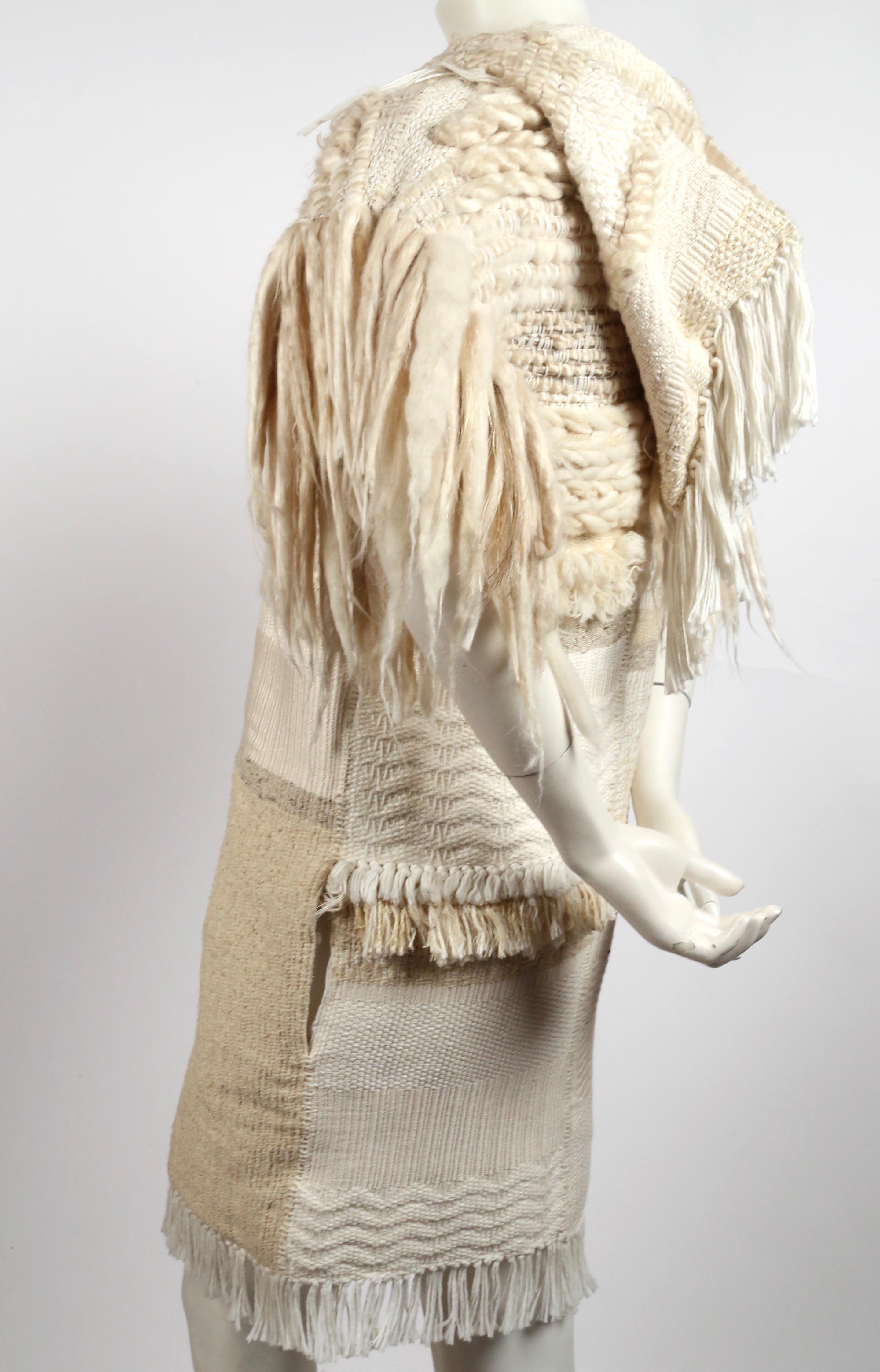 Beautiful, handwoven textile coat in tones of white and cream designed by Phoebe Philo for Celine exactly as seen on the spring 2011 runway. Very rare piece. French size 38. Approximate measurements: bust 38