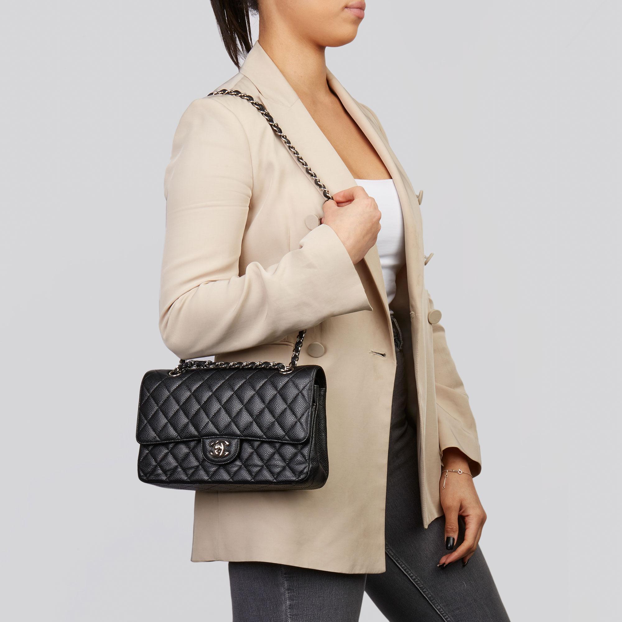 CHANEL
Black Quilted Caviar Leather Medium Classic Double Flap Bag 

Xupes Reference: HB3658
Serial Number: 15847968
Age (Circa): 2011
Accompanied By: Chanel Dust Bag, Authenticity Card
Authenticity Details: Authenticity Card, Serial Sticker (Made