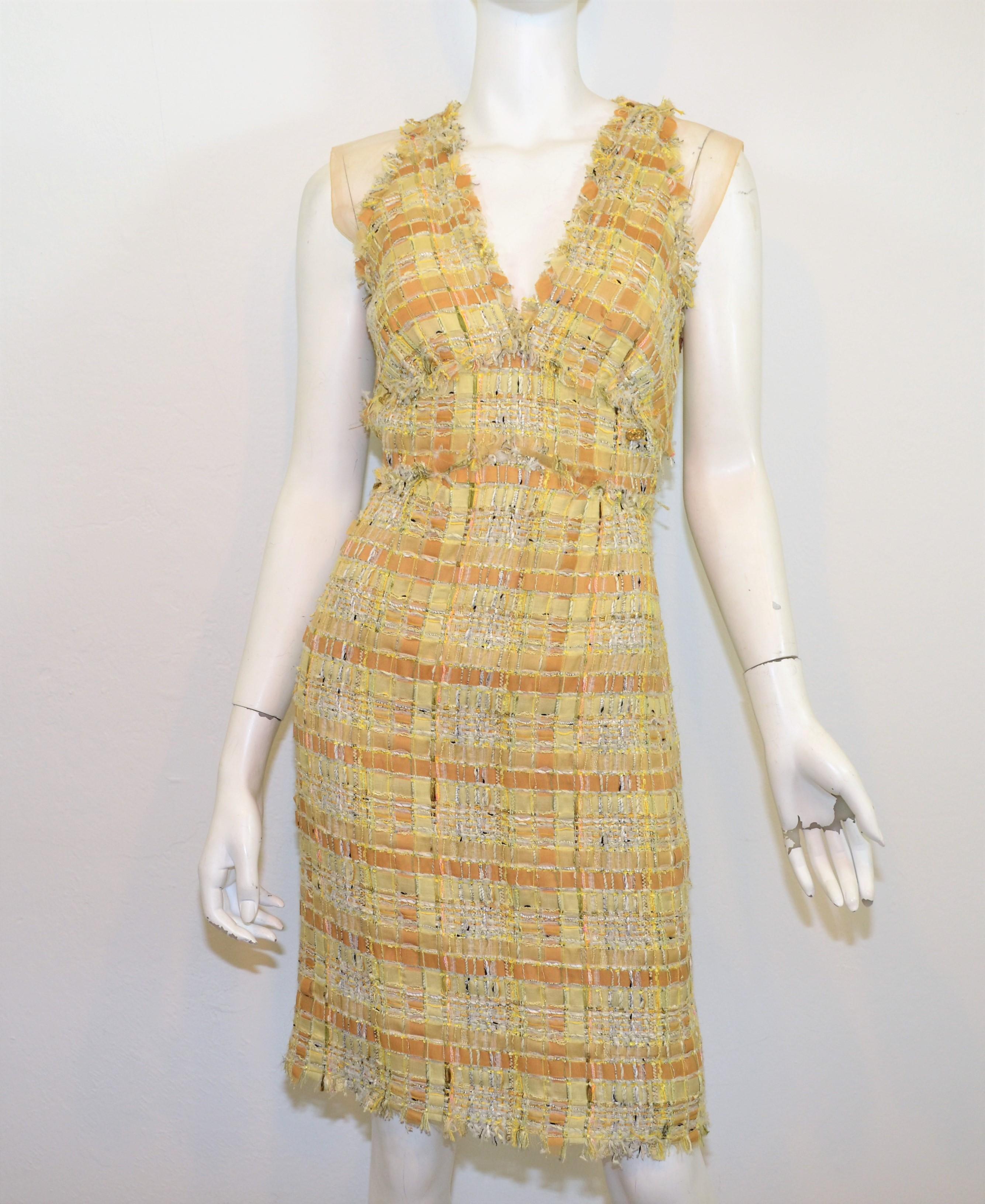 From the 2011 Spring RTW collection -- Chanel dress features a multicolored yellow ribbon woven tweed fabric . Dress has a back zipper and hook-and-eye fastening. Made in France. Size 38. 45% rayon, 21% nylon, 18% silk, 10% cotton, and 6% other