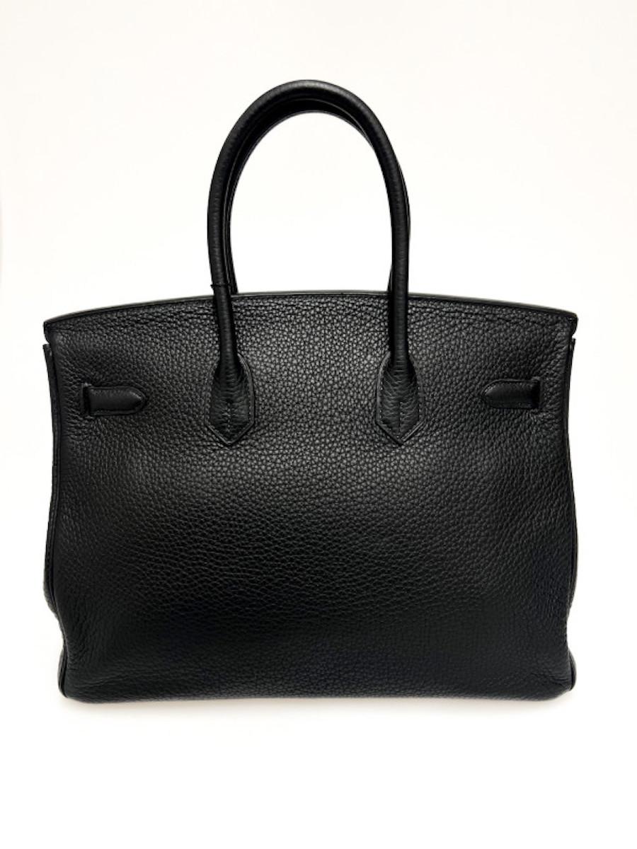 Iconic Hermès Birkin 35 bag black Togo leather, delivered in its original Hermès dustbag.
Has its zipper, bell, padlock and keys (x2). The corners are in very good condition.
Condition: very good
Made in France
Model: Birkin 35
Material: Togo calf