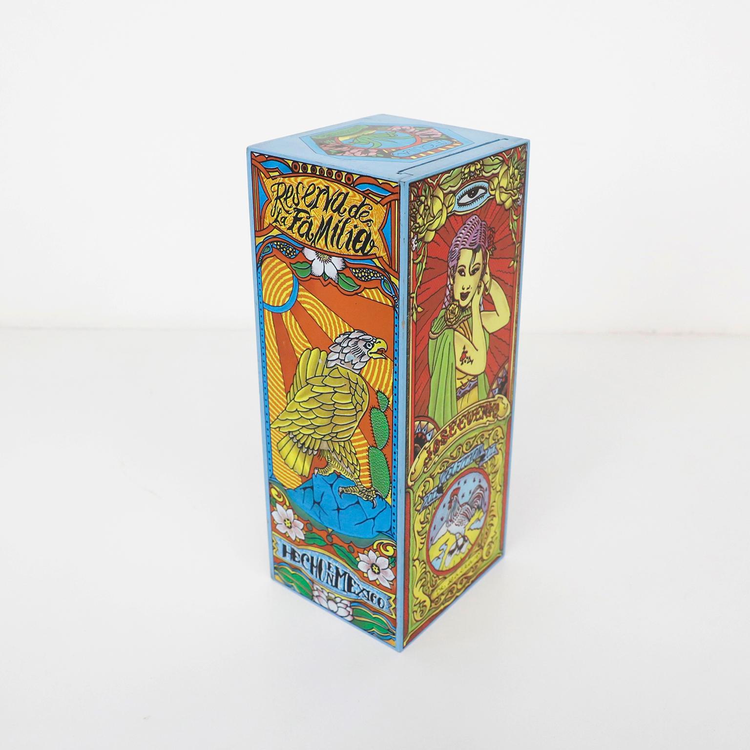 Awesome wood tequila box featuring Dr. Lakra art on every surface. Made to hold Jose Cuervo Tequila Reserva De La Familia, 2011. Very limited edition. Box can hold a bottle or be used as a stash box. Silk screen type printing. In excellent shape and