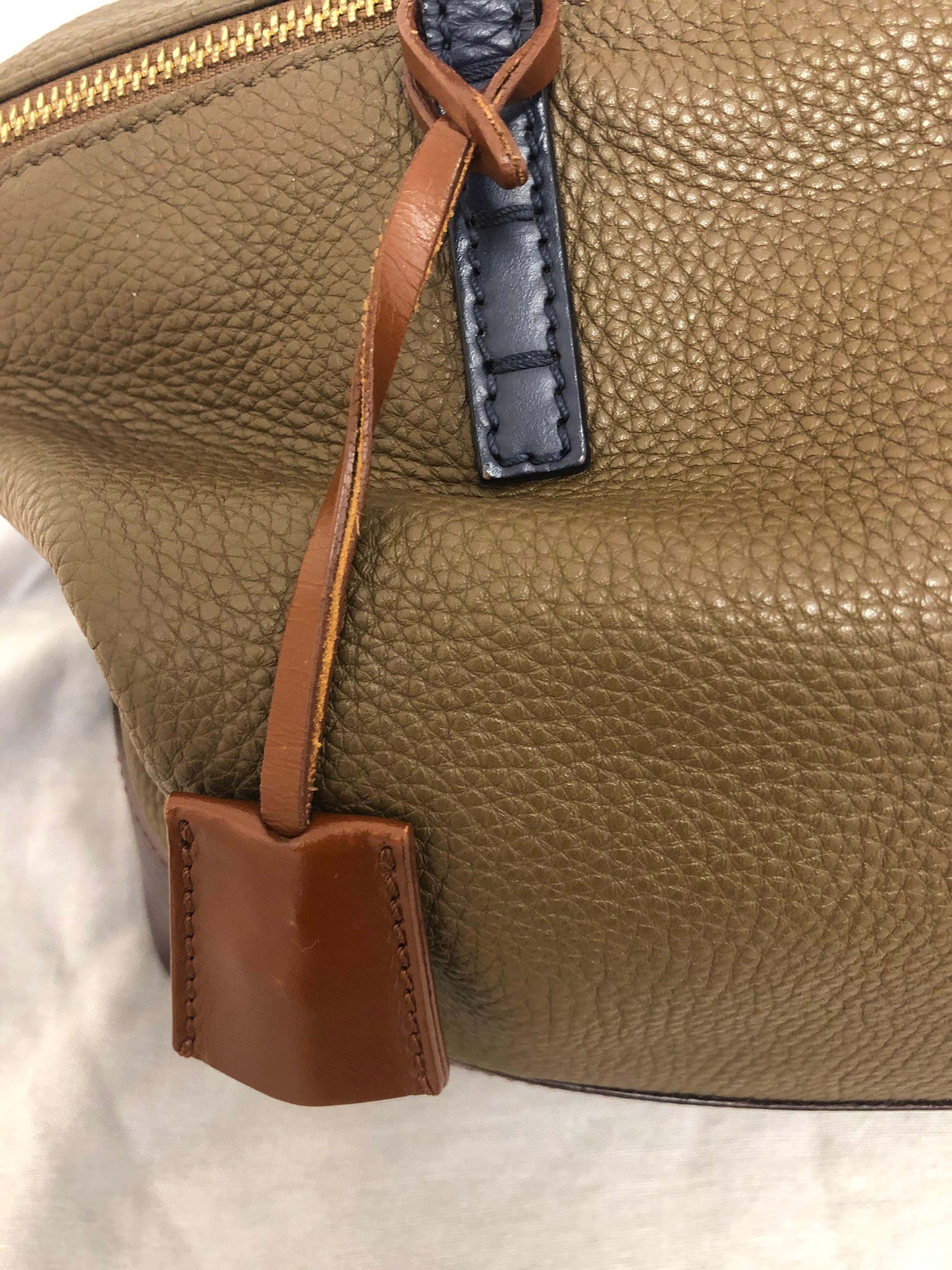 This 2011 Fendi Tri-Color 2Bag is very well made in three colors of leather (beige, brown and purple), and very versatile. The condition is very good except for rubbing on some of the bottom edge corners (shown in pictures). The inside is very clean