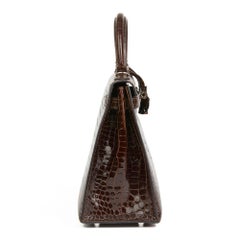 2011 Hermès  Chocolate Brown Shiny Porosus Crocodile Leather Kelly 28cm Sellier