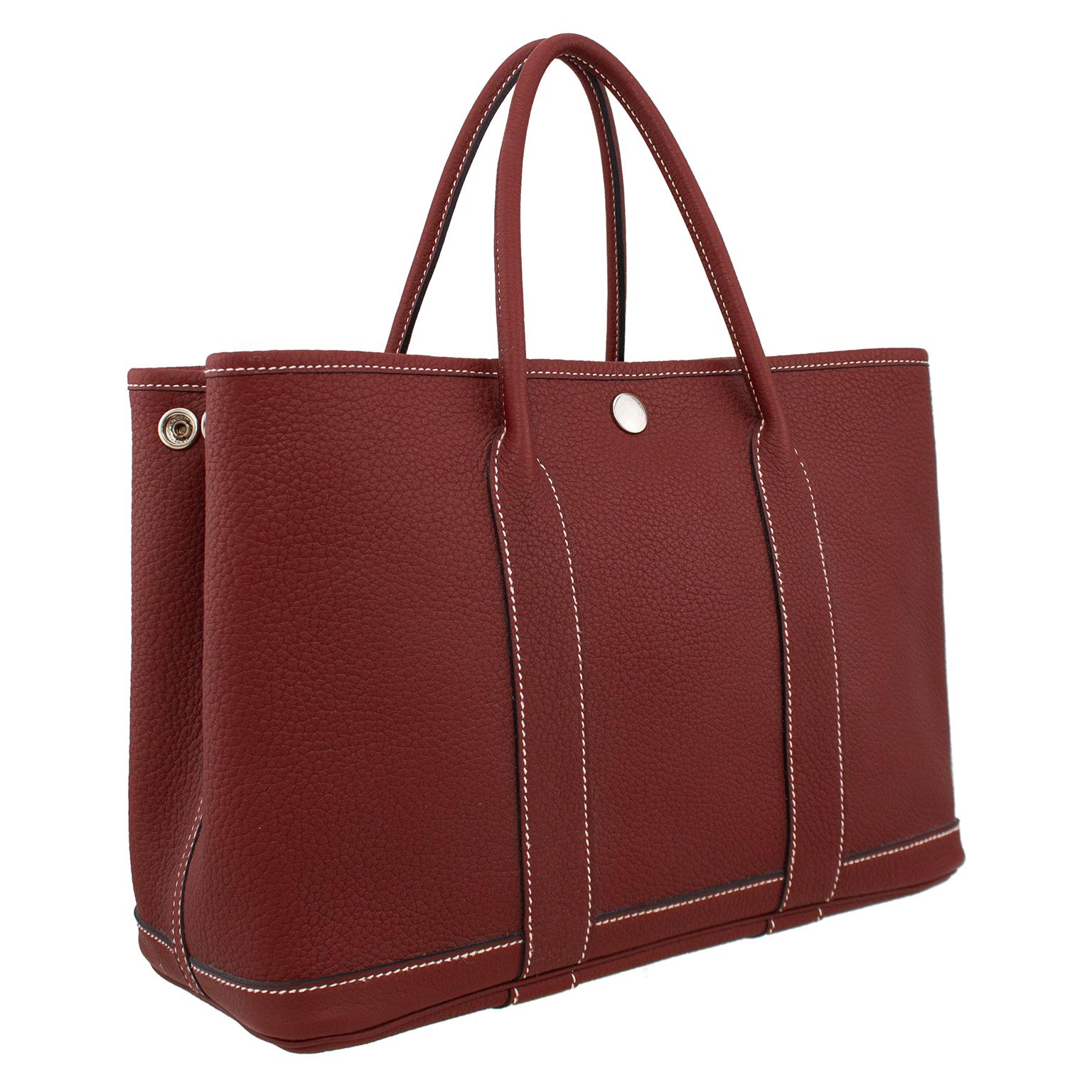 Released in 1964, the Garden Party bag is Hermès' take on the practical tote bag. Handmade from rouge Negonda leather, this piece is a fine example of the brand's minimalistic yet exceptional craftsmanship. This elegant bag also features two rolled