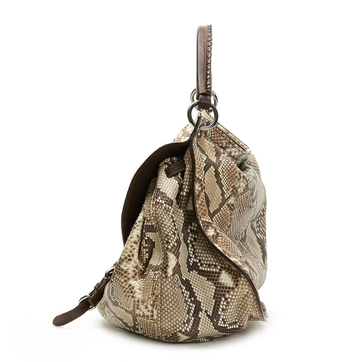 MIU MIU
Python Leather Aviator Hobo Bag

Reference: CB114
Serial Number: 37
Age (Circa): 2011
Accompanied By: Miu Miu Dust Bag, Care Card, Shoulder Strap
Authenticity Details: Serial Tag (Made in Italy)
Gender: Ladies
Type: Shoulder, Tote,