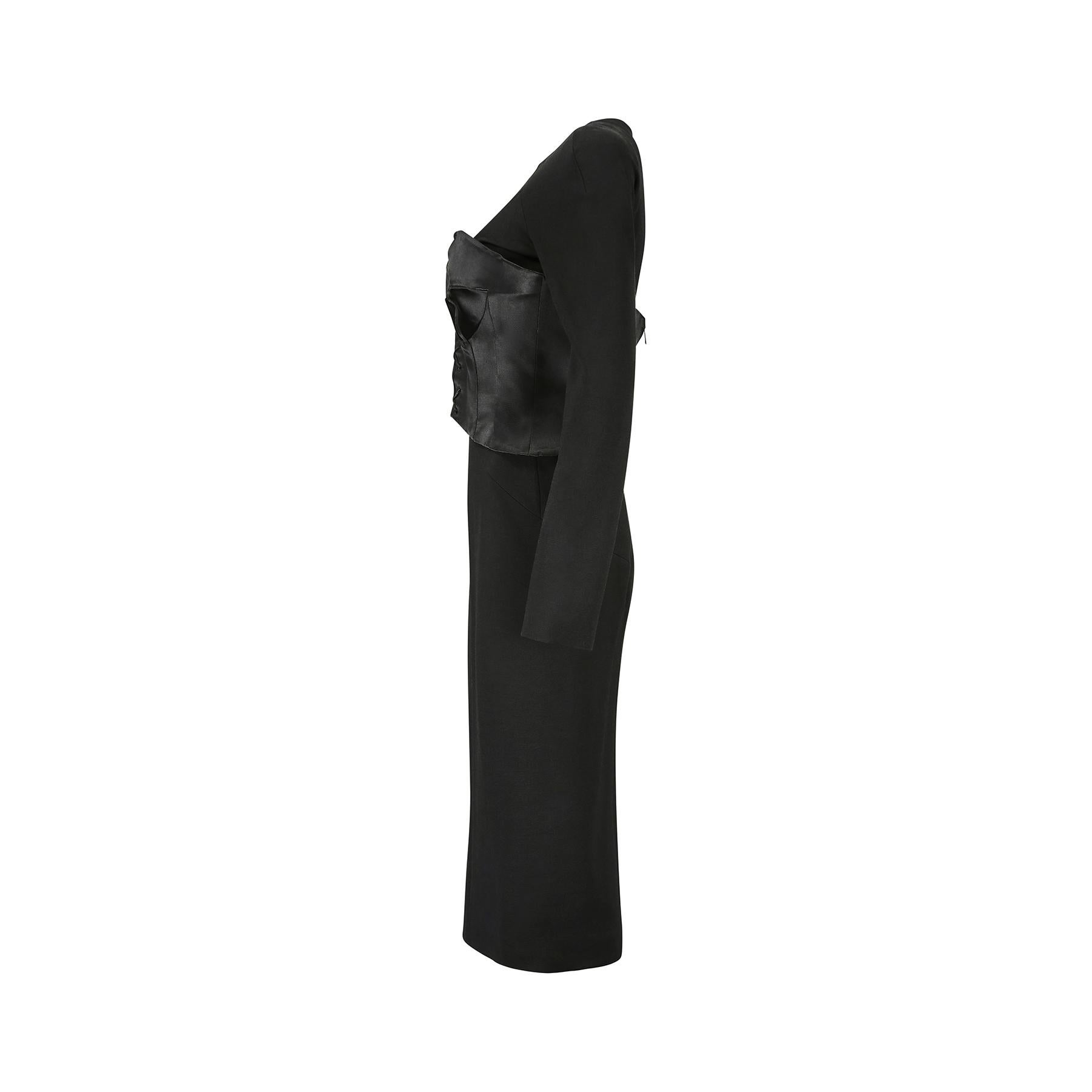 This sophisticated Tom Ford black jersey and satin corset dress is a super flattering and sexy design, perfect for party season. It comprises a long sleeve black jersey wool dress with integral black satin bustier detail, with front ties to create a