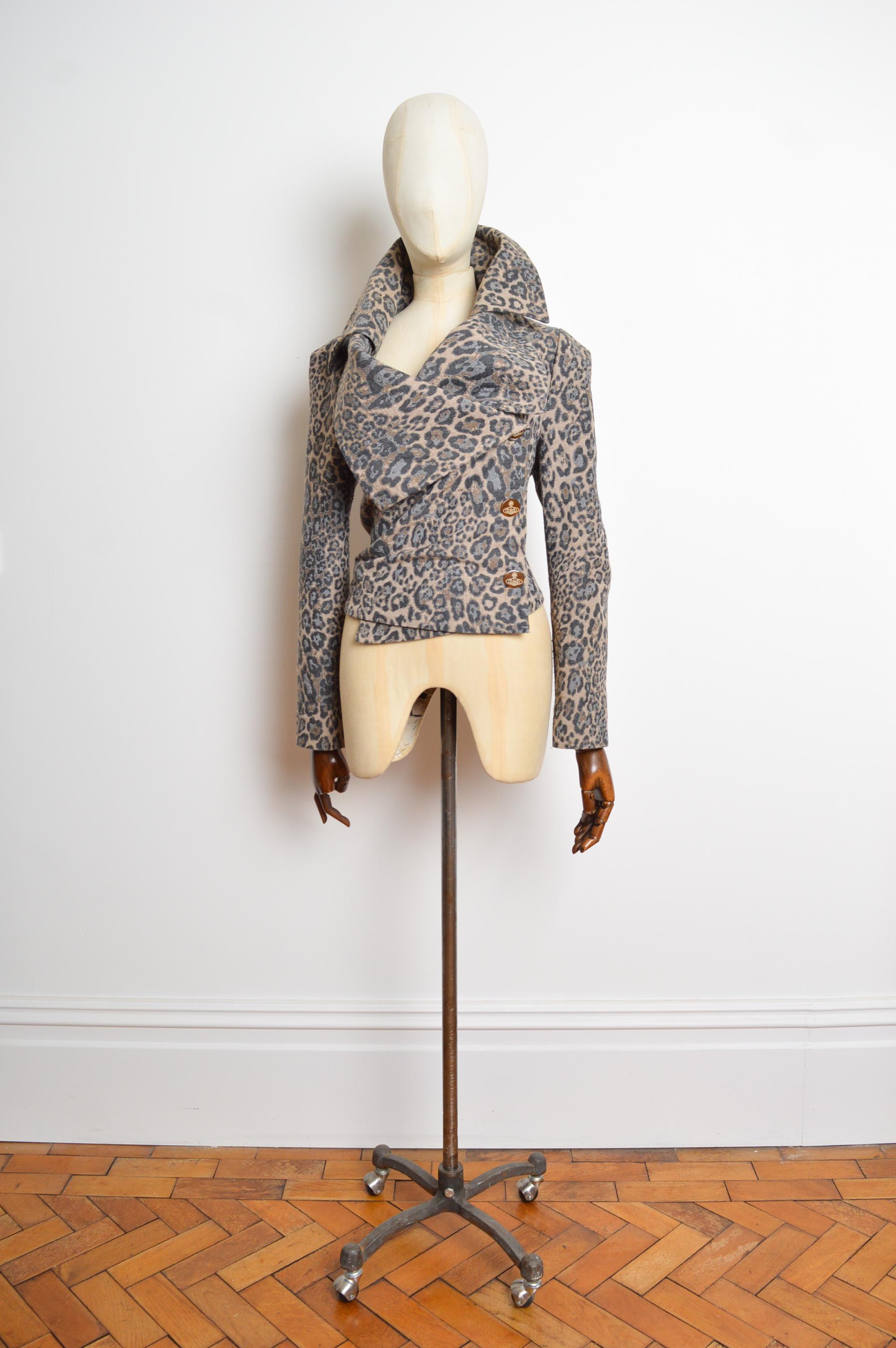 Superb 2011 Red Label Vivienne Westwood Leopard print jacket, with signature Orb button detailing, striped cotton lining and Asymmetric structured silhouette. 
Size; Recommended Size UK 12. 
Measurements are provided in inches (‘’)
Pit to Pit;