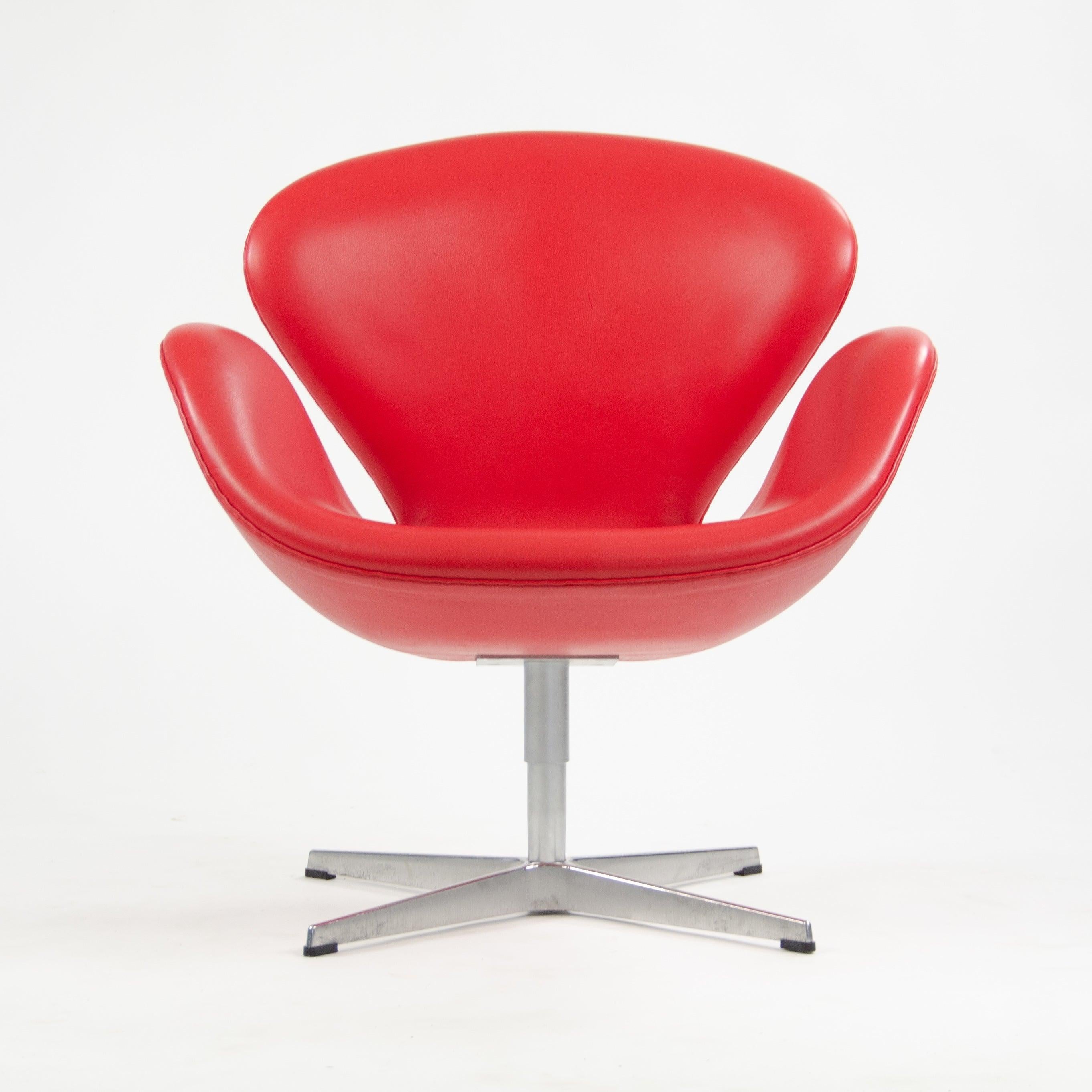 Listed for sale are four (sold separately) recent production Arne Jacobsen swan chairs, produced by Fritz Hansen in 2012.

The chairs are in terrific original condition! See photos for reference.

The chairs have a beautiful red leather upholstery