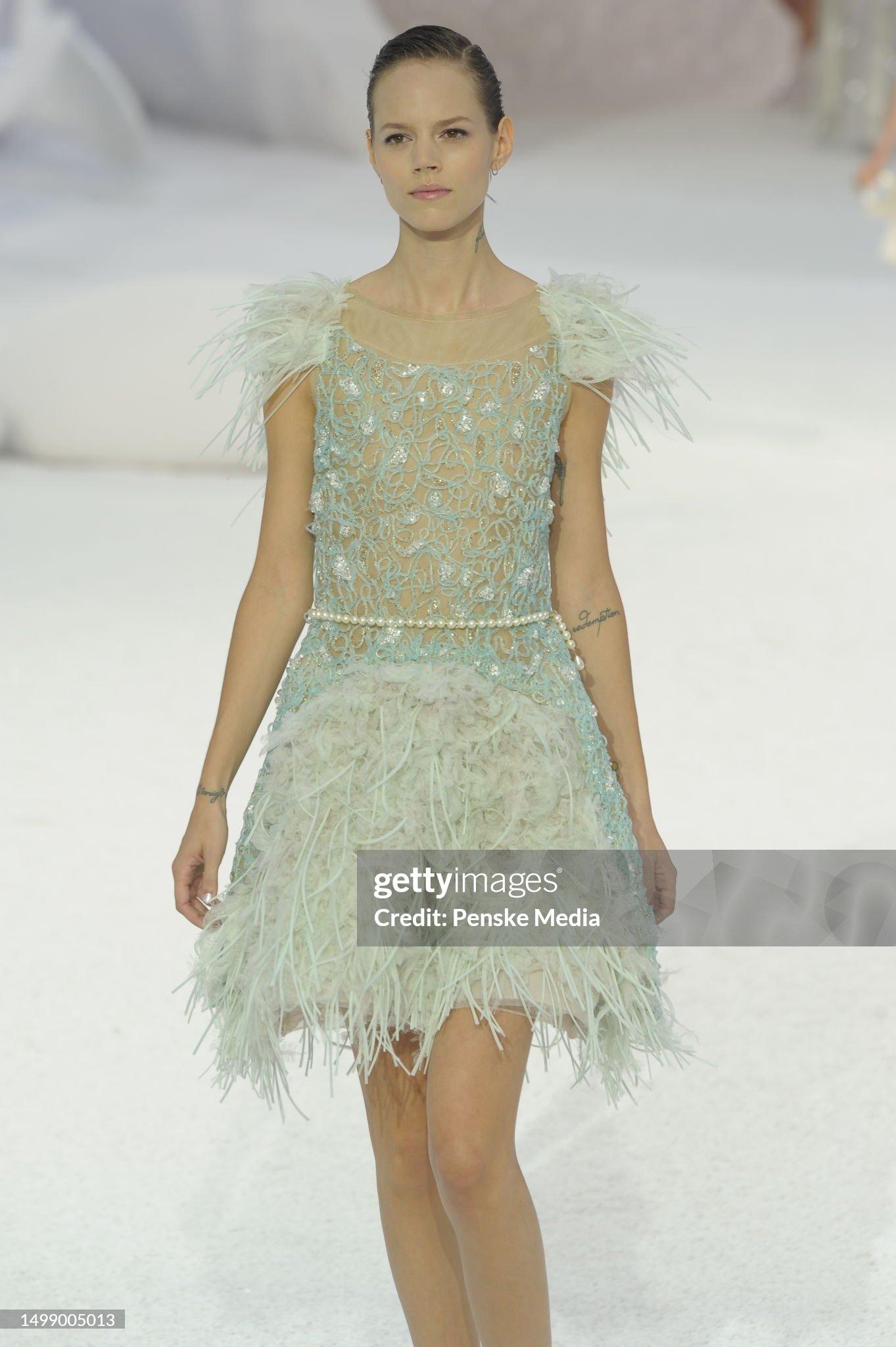 An incredibly ethereal and highly coveted Chanel crystal beaded sheer illusion silk-net sculpted mini dress dating back to Karl Lagerfeld's ocean-themed 2012 spring/summer runway collection. This incredibly rare dress was look number 75, modeled by
