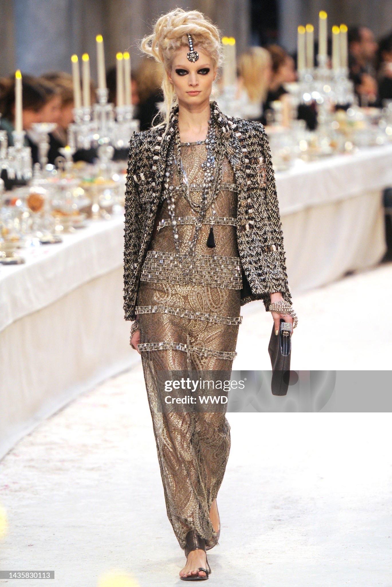 An incredibly chic and highly coveted Chanel crystal beaded sheer metallic silver and gold paisley-motif lamé lace dress dating back to Karl Lagerfeld's epic pre-fall 
