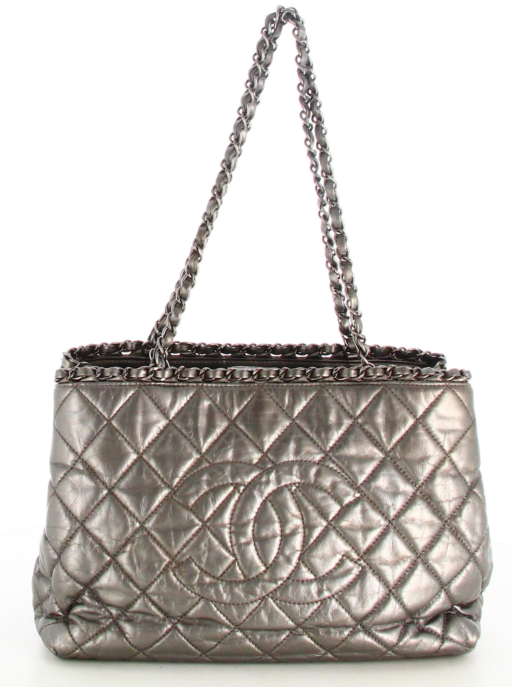 2012 Chanel Chain Me Tote Handbag Grey

- Very good condition. Shows signs of wear over time. 
- Chanel Handbag 
- Quilted grey leather
- Double silver chain handle 
- Interior: black lining plus inside pocket