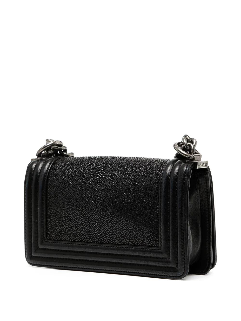 An iconic bag of the French fashion house, the Chanel Boy bag was originally inspired by a cartridge bag, made for hunters. Offering a more modern and edgy twist than the classic flap, this pre-owned bag from 2012 has been crafted from galuchat