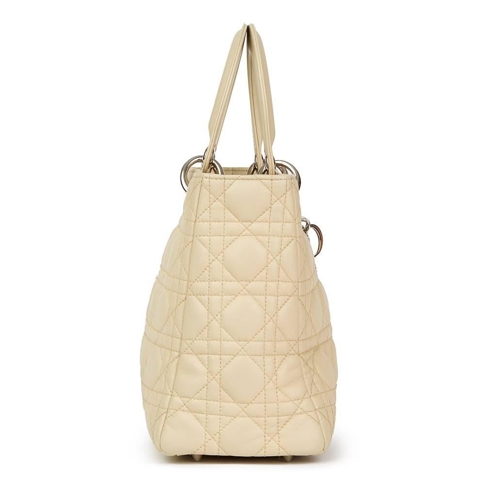 CHRISTIAN DIOR
Beige Quilted Lambskin Lady Dior MM

Reference: HB1758
Serial Number: 08-MA-0112
Age (Circa): 2012
Accompanied By: Dior Dust Bag, Shoulder Strap
Authenticity Details: Serial Stamp (Made in Italy)
Gender: Ladies
Type: Top Handle, Tote,