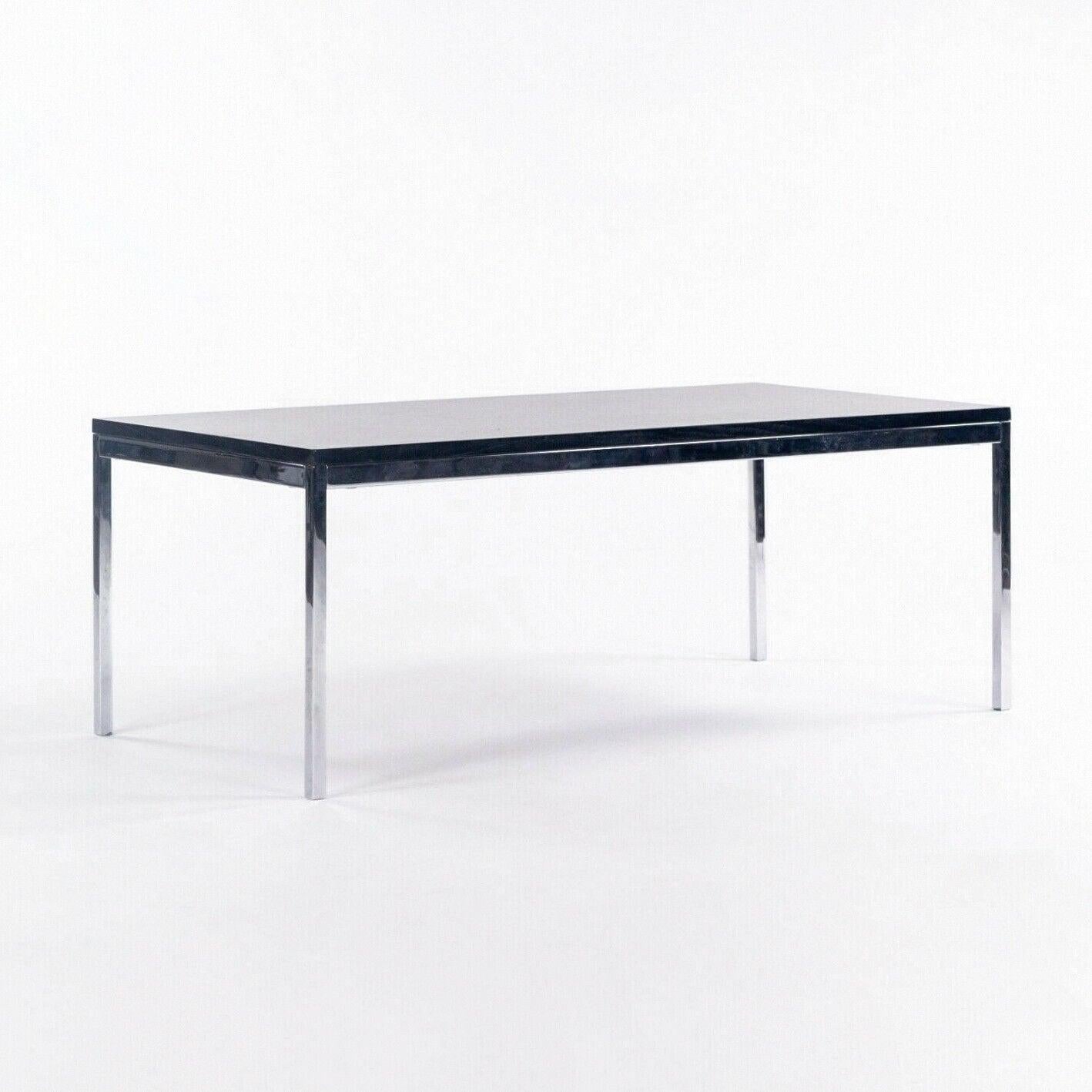 Listed for sale is a 2012 production Florence Knoll coffee table with chromed steel base and ebonized walnut top. This is a classic Florence Knoll design. The top is in excellent condition with only minimal wear. The chrome is also in beautiful