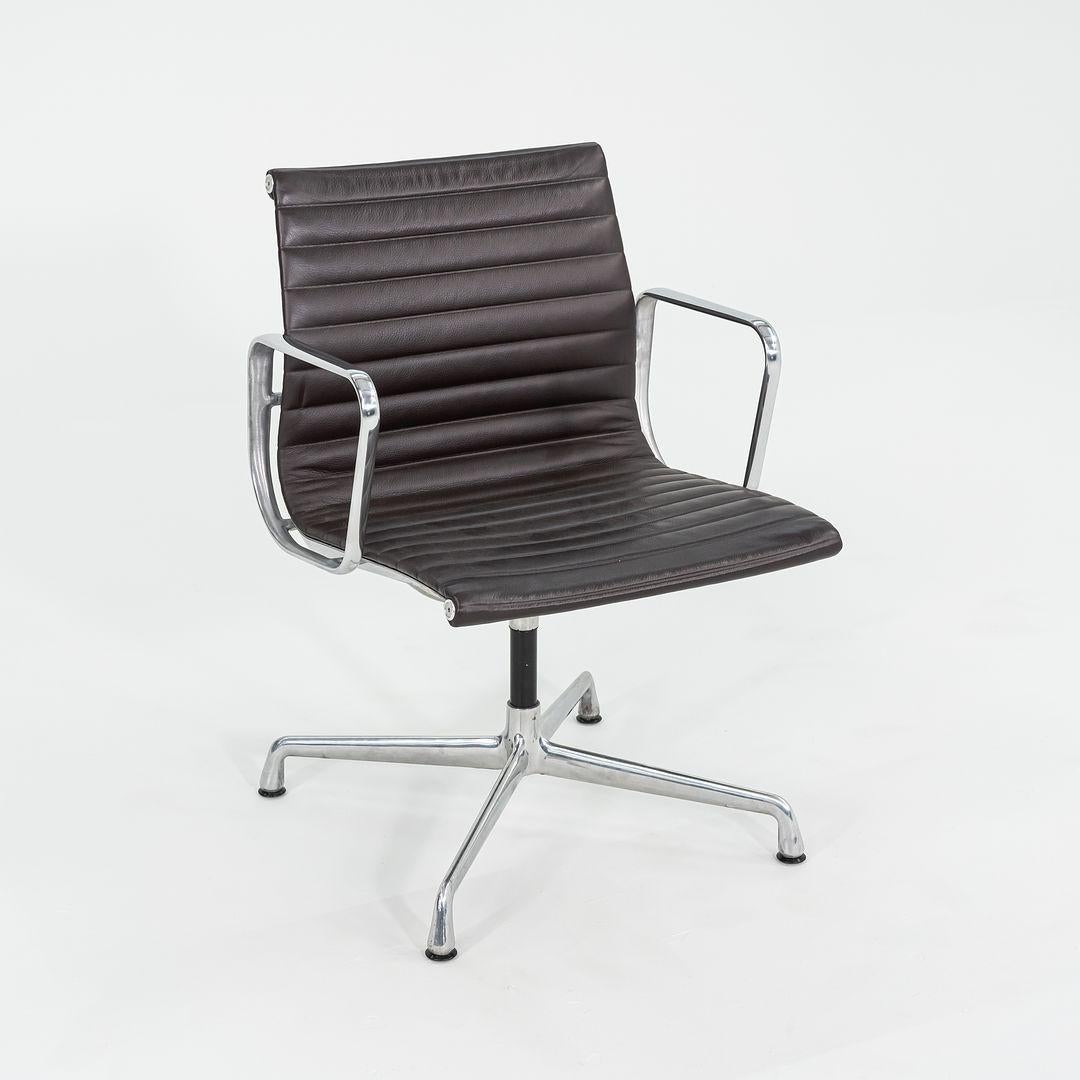 This is an Eames Aluminum Group Management Desk or Side Chair, model EA-108, designed by Charles and Ray Eames for Herman Miller in 1958. These examples were produced in 2012. The listed price includes one chair, and we have several available for