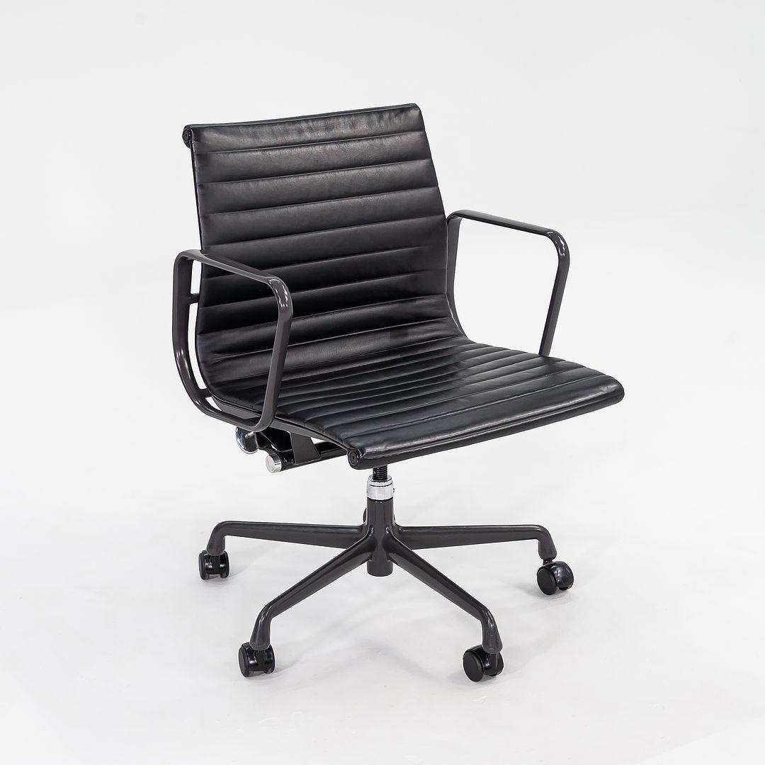 This is an Eames Aluminum Group Management Desk Chair, model EA335, originally designed by Charles and Ray Eames for Herman Miller in 1958. These particular examples date to 2012. The listed price includes one chair, and we have several available
