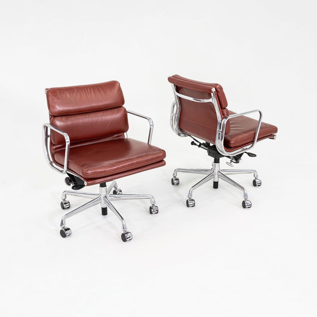 This is an Eames Aluminum Group Soft Pad Management Desk Chair, Model EA435, originally designed by Charles and Ray Eames for Herman Miller in 1969. These particular examples date to the the year 2012. The design features a cast aluminum frame with