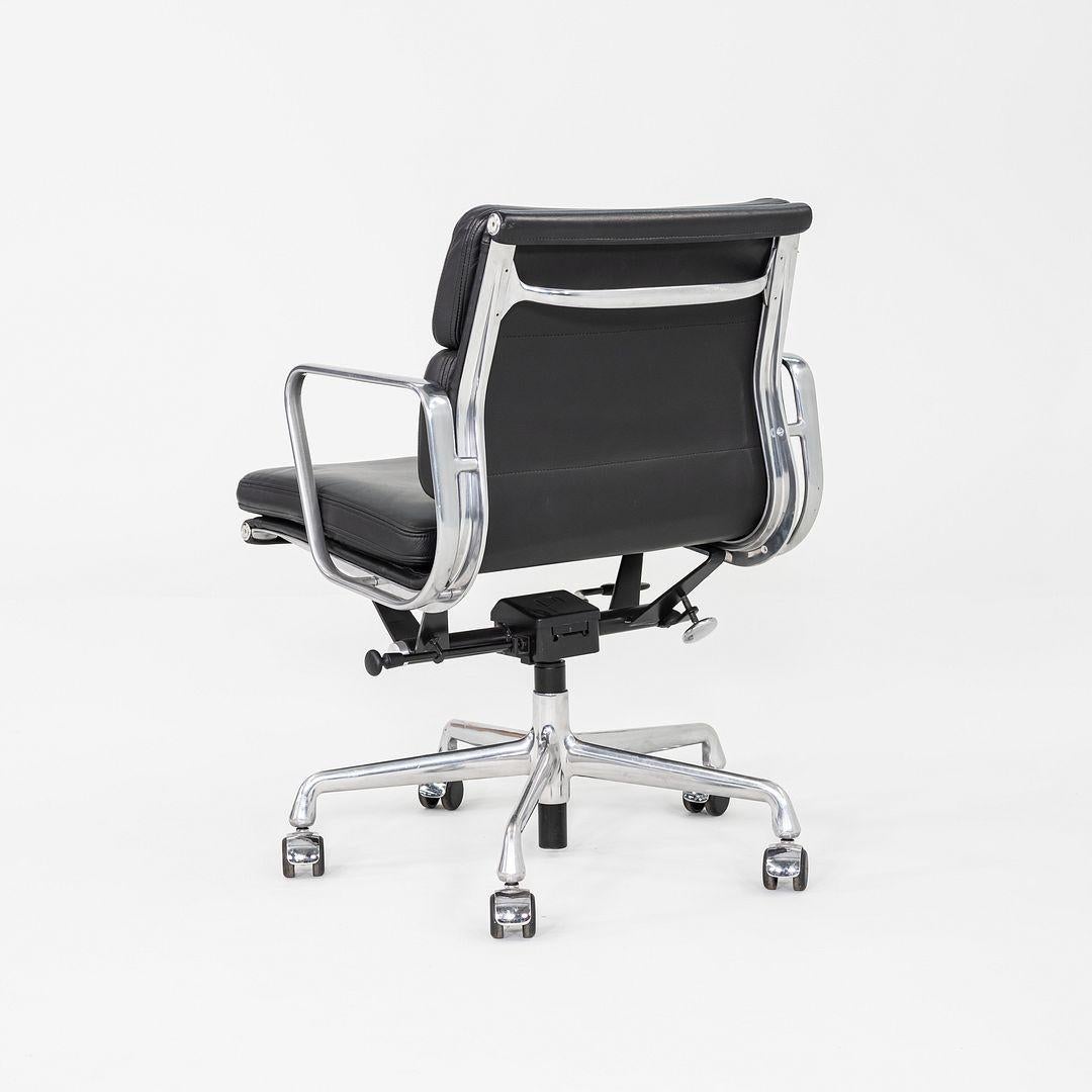 These are Eames Aluminum Group Soft Pad Management Chairs, Model EA435, initially designed by Ray and Charles Eames for Herman Miller in 1969. These examples date to 2012. Their design features a cast aluminum frame, and they have a pneumatic