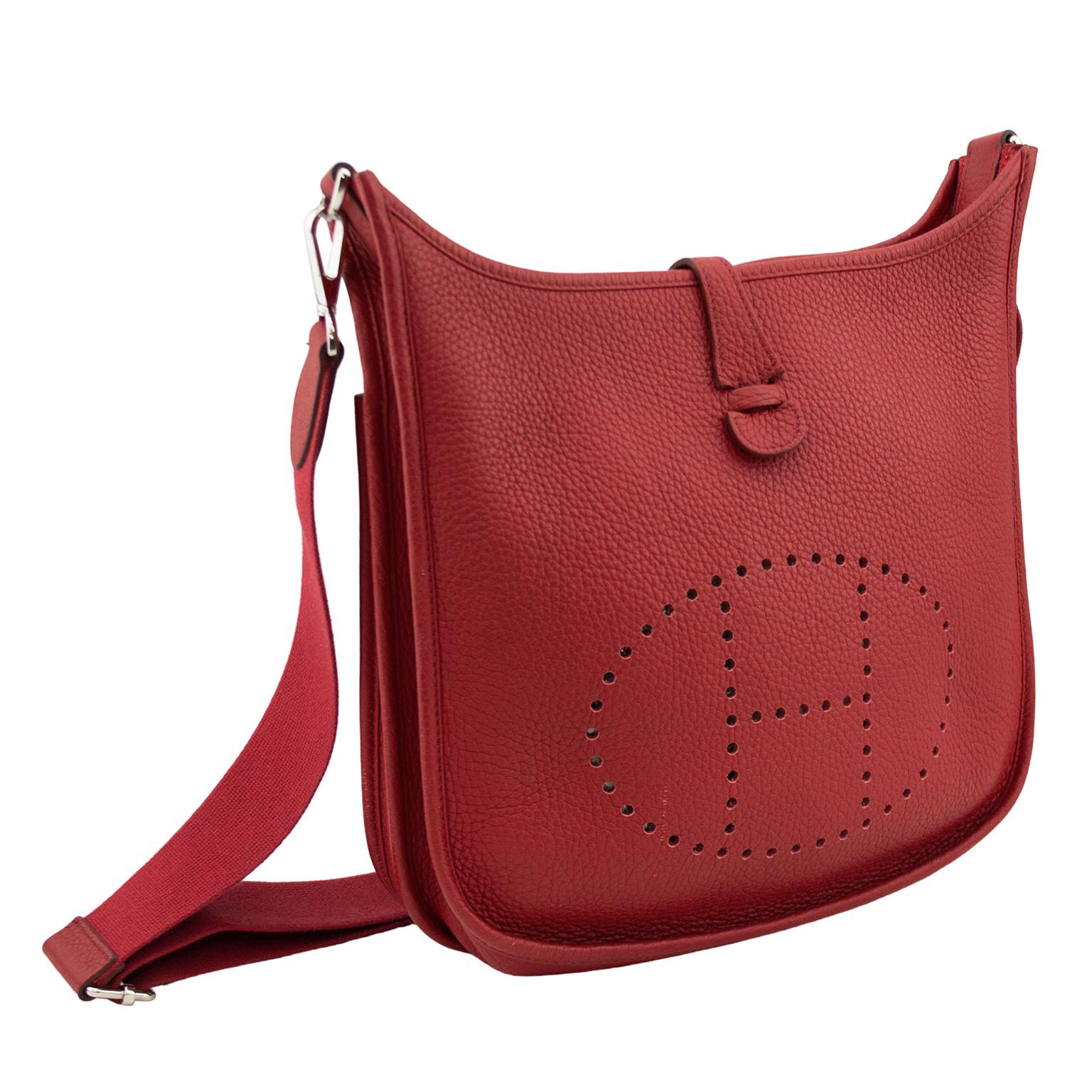 2012 Rouge Garance Clemence grained leather Hermès Evelyne III PM 29 cross body bag with silver-tone hardware, single detachable and adjustable flat shoulder strap, single slit pocket at exterior wall, tonal suede interior lining and snap closure at