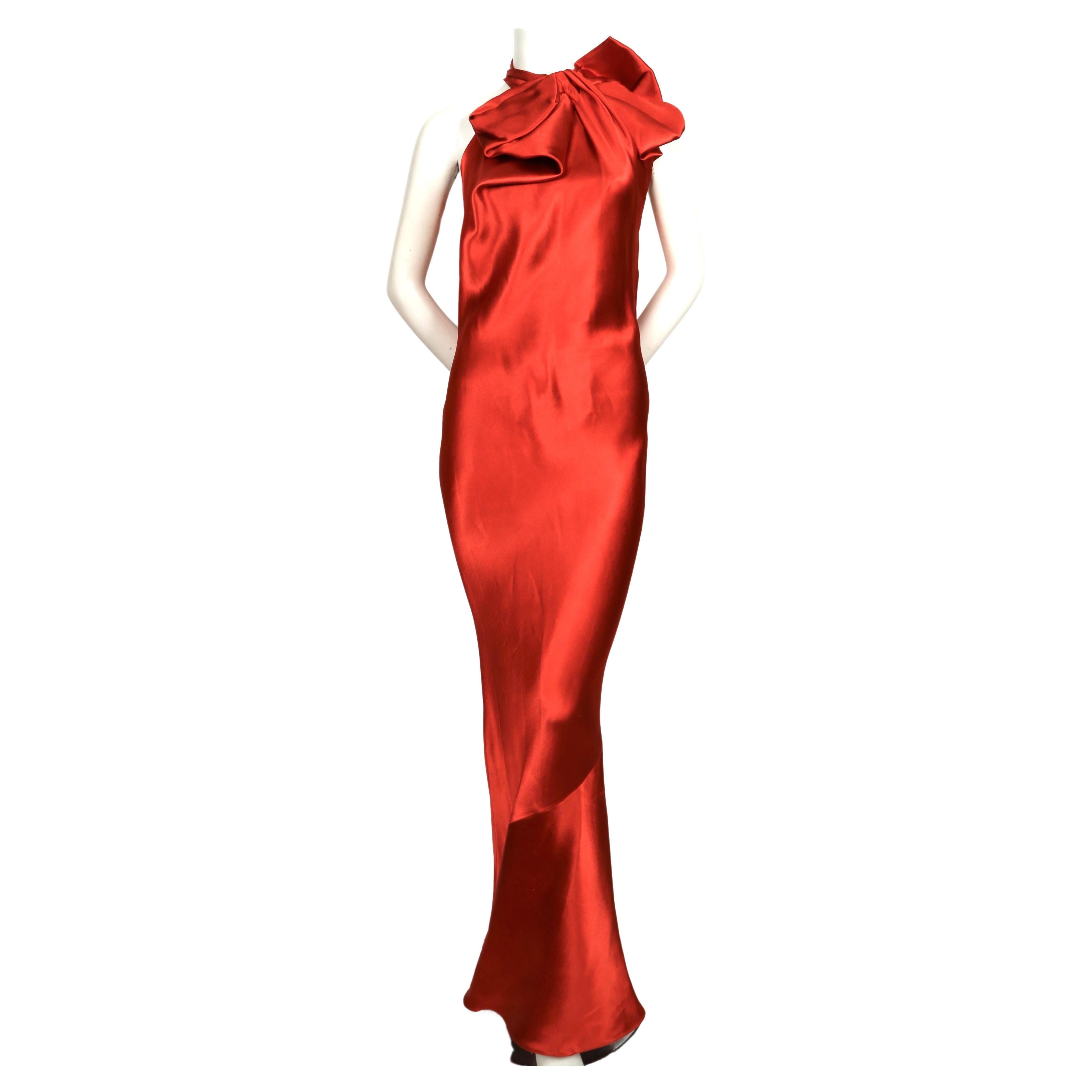 Rich, terra-cotta bias cut gown with trapped collar designed by Alber Elbaz for Lanvin dating to Fall of 2012. French size 38 however there is some flexibility in sizing due to the bias cut. Measurements are very difficult to accurately take because
