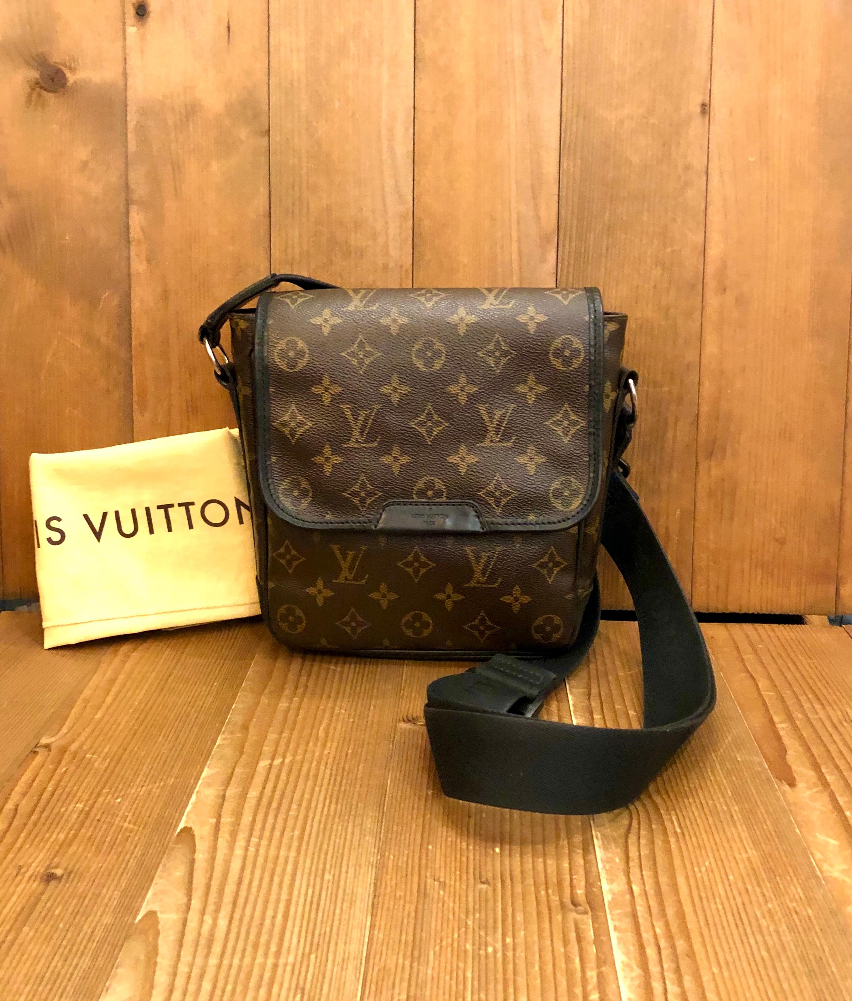 This Louis Vuitton crossbody is crafted of monogram coated canvas with black polished cowhide leather trimmings. The extra-long black nylon strap is adjustable with silver tone hardware. The flap stays secured with two hidden magnets underneath the