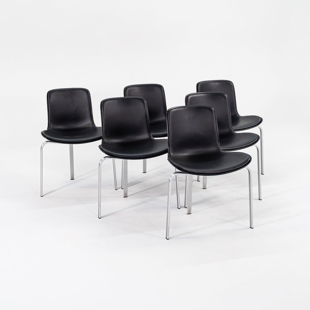 These are PK8 Dining Chairs, initially designed by Poul Kjaerholm in 1978. These particular examples date to 2012 and were produced by Fritz Hansen in Denmark. The listed price includes one chair, and we have several pieces available for purchase.