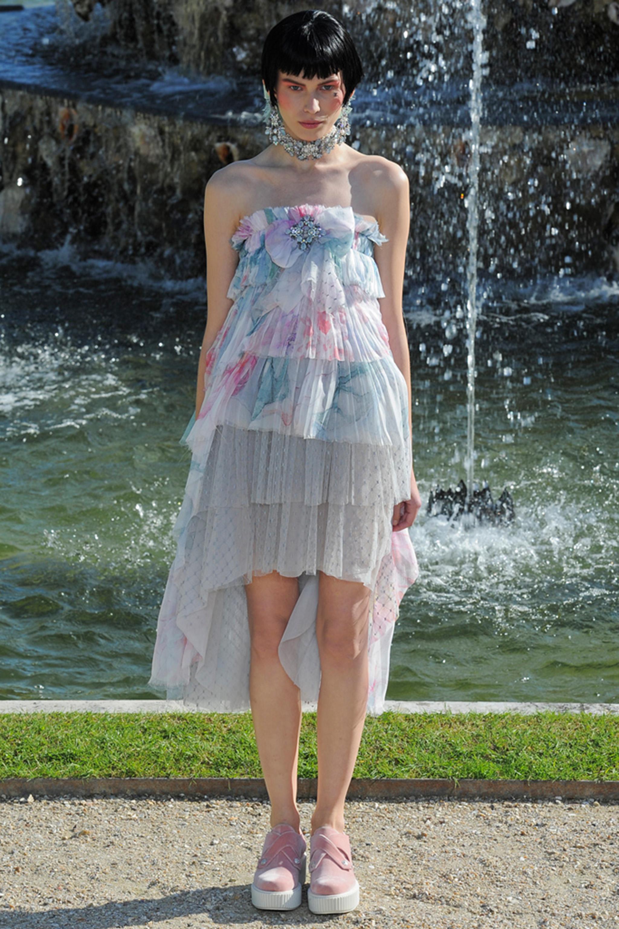 An incredibly chic and highly coveted Chanel pastel floral print silk and sheer dotted net mini dress dating back to Karl Lagerfeld's 2013 cruise collection. This ultra rare dress was look number 44, modeled by the beautiful Monika Sawicka. Not only