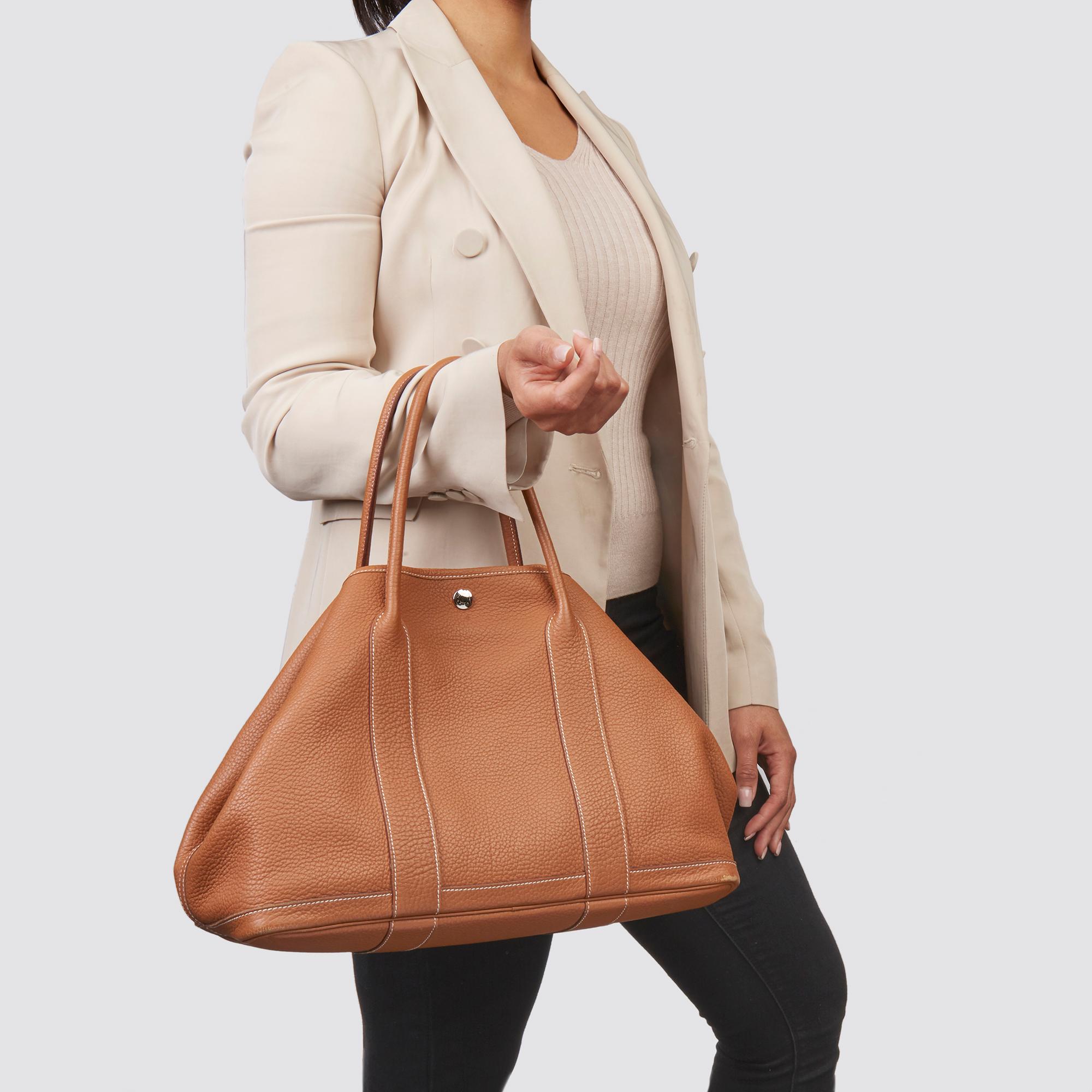 HERMÈS
Gold Negonda Leather Garden Party 36cm 

Xupes Reference: CB203
Serial Number: [Q]
Age (Circa): 2013
Accompanied By: Hermès Dust Bag, Box
Authenticity Details: Date Stamp (Made in France) 
Gender: Ladies
Type: Tote

Colour: Gold
Hardware:
