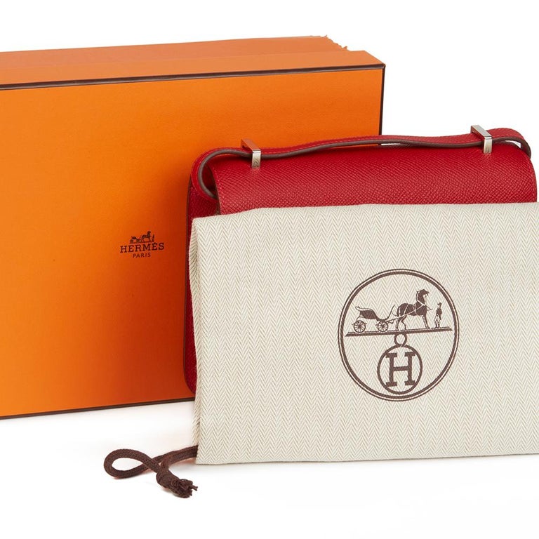 Constance leather clutch bag Hermès Orange in Leather - 35871229