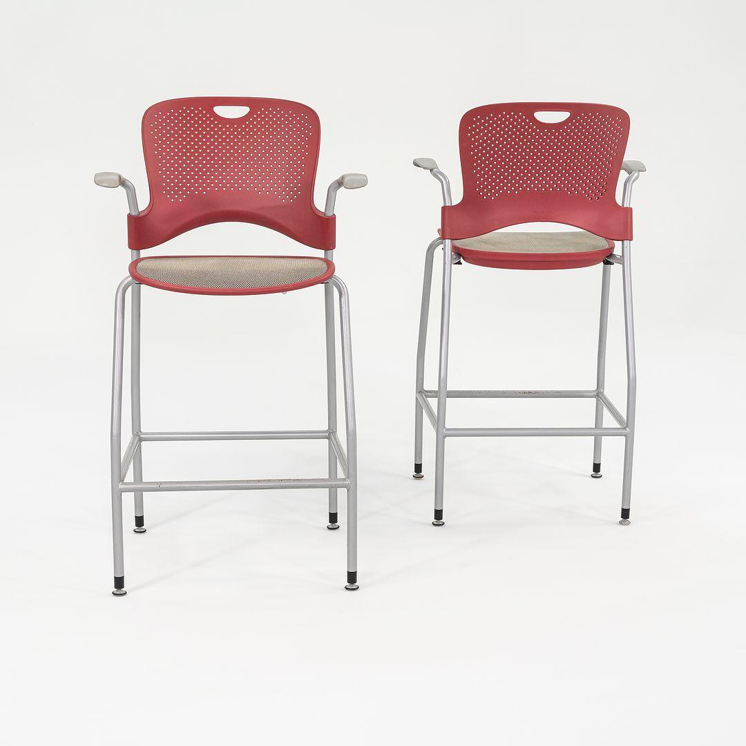 These are Stacking Caper Bar Stools. Originally designed by Jeff Weber for Herman Miller in 1999. These particular examples were produced by Herman Miller in 2013 in the USA. The stools are comprised of steel and plastic, and are equipped with a