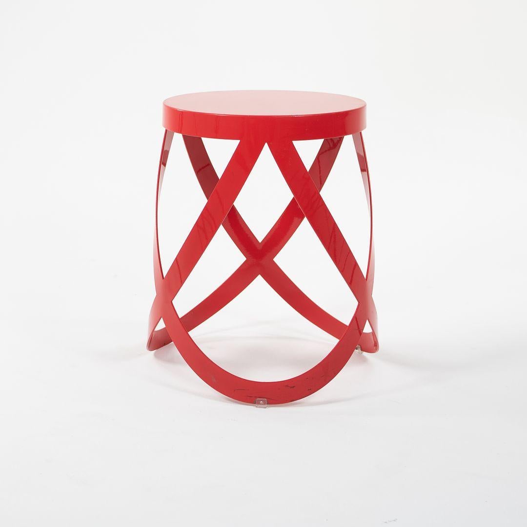 This is a Nendo Low Ribbon Stool, designed by Nendo for Cappellini. Nendo is the name of a collective of professionals, under the guidance of architect Oki Sato. Each stool is constructed from a single sheet of metal, with sculptural laser-cut