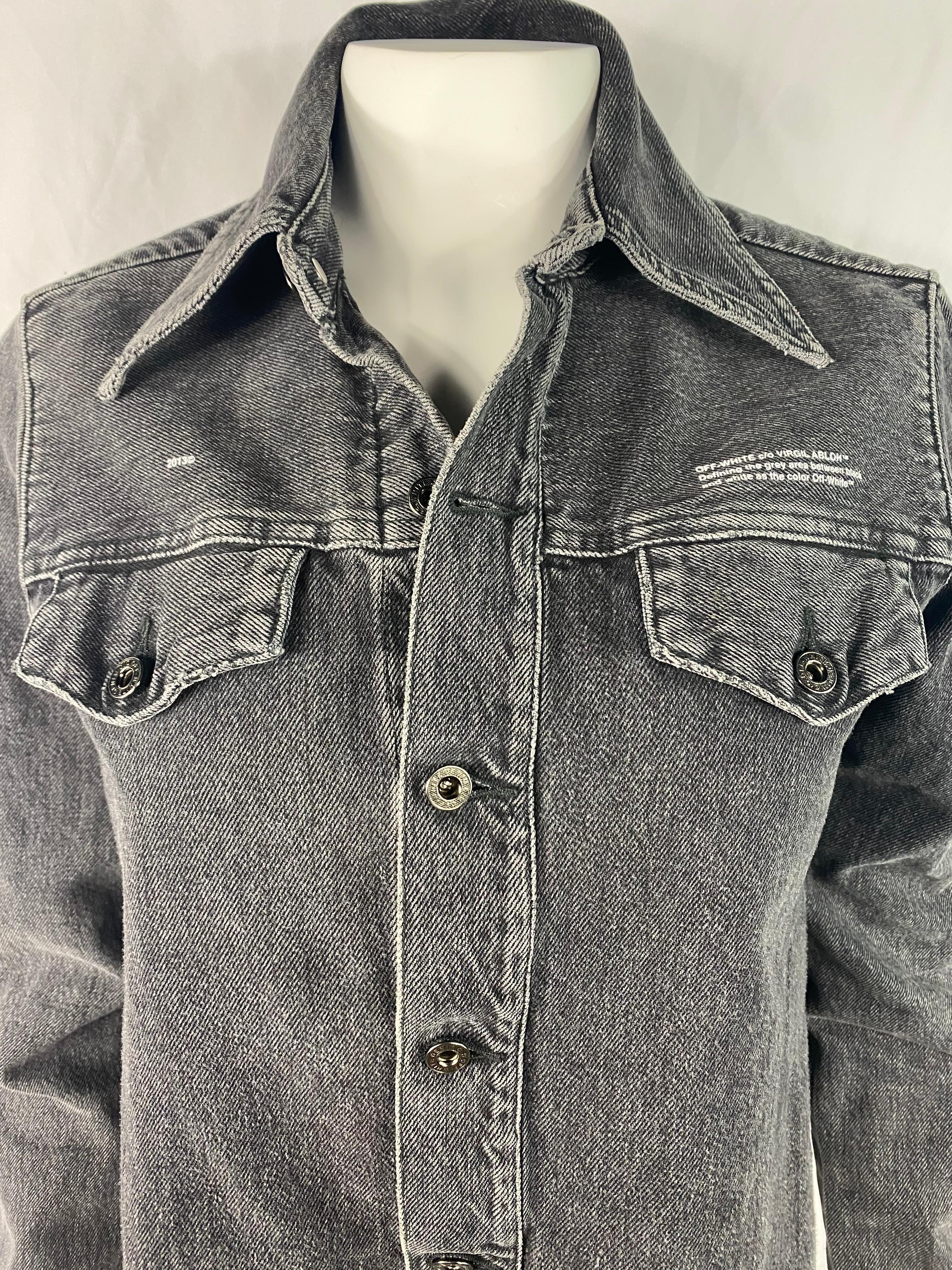 Product details:

The jacket features light grey wash, front  button down closure with dual front pockets and side slits. The front of the jacket is shorter than the back. The front measures 22 inches long and the back is 27.5 inches long.