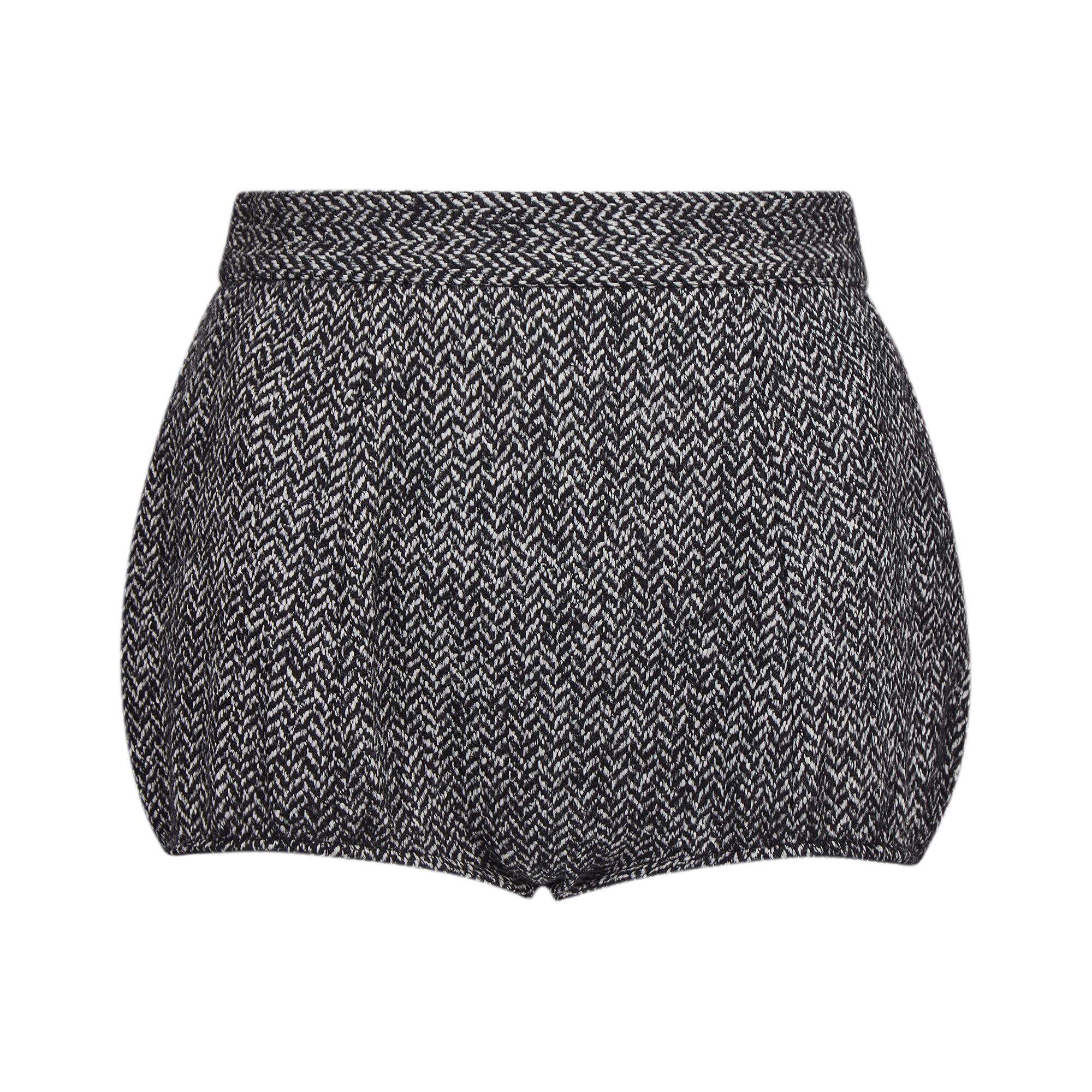 Documented Dolce and Gabbana mainline collection monochrome tweed hot pants. These are the exact version that were featured from the 2013 Fall ready to wear show, look 19 and shown here, look 24 on the runway. 

They are of a very pure, pin-up style