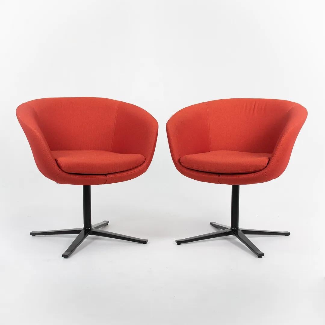 This is a Bob Guest Swivel Chair, Model 231, designed by Luke Pearson and Tom Lloyd of Pearson Lloyd for Coalesse and Walter Knoll in 2014. The listed price includes one chair. We have several available for purchase. The chairs sport a red/orange